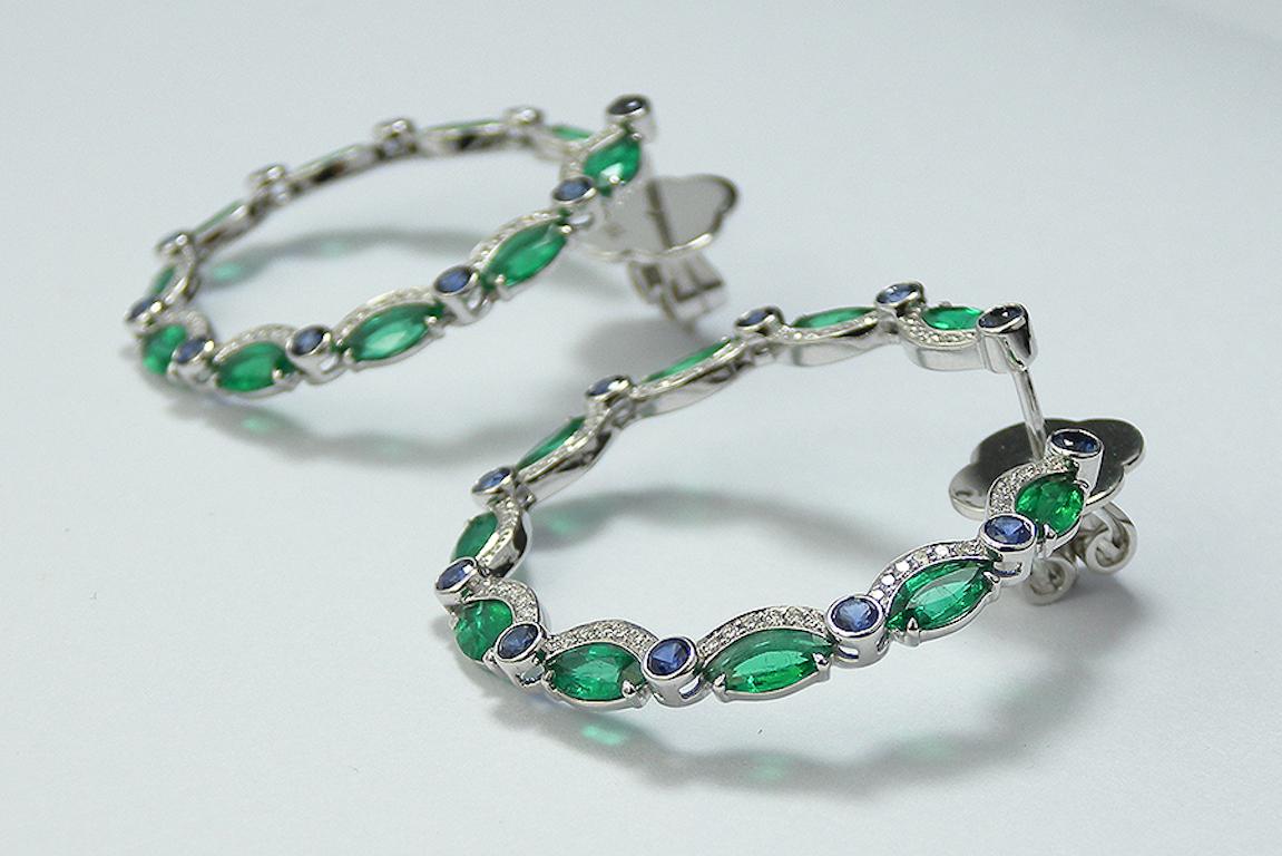 Elegant and Captivating Inside-out hoop earrings crafted in White Gold with alternated Round Blue Sapphire and Marquise Emerald outlined with a half halo of Diamond.
Earrings details : 
Emerald : 3.80 Total carat weigh
Blue Ceylan Sapphire : 1.40
