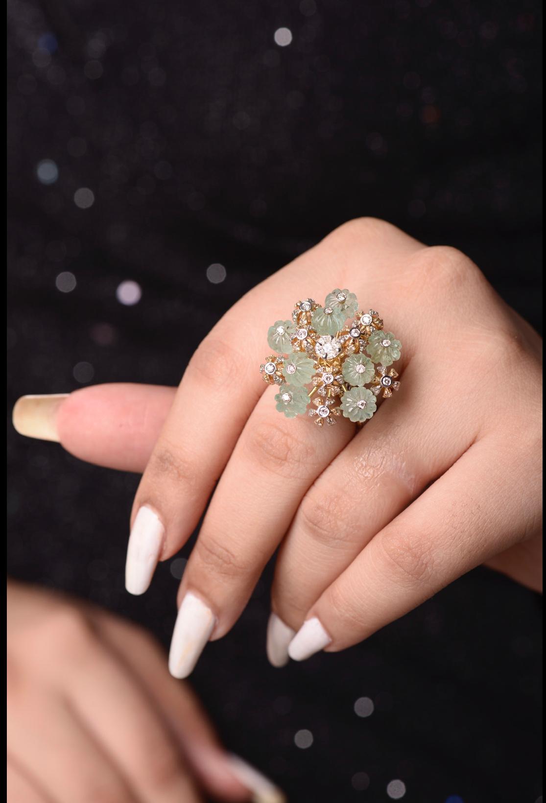 This ring is of  Magnificent design and is made with a combination of diamonds , Emerald melons and high quality Russian emeralds.