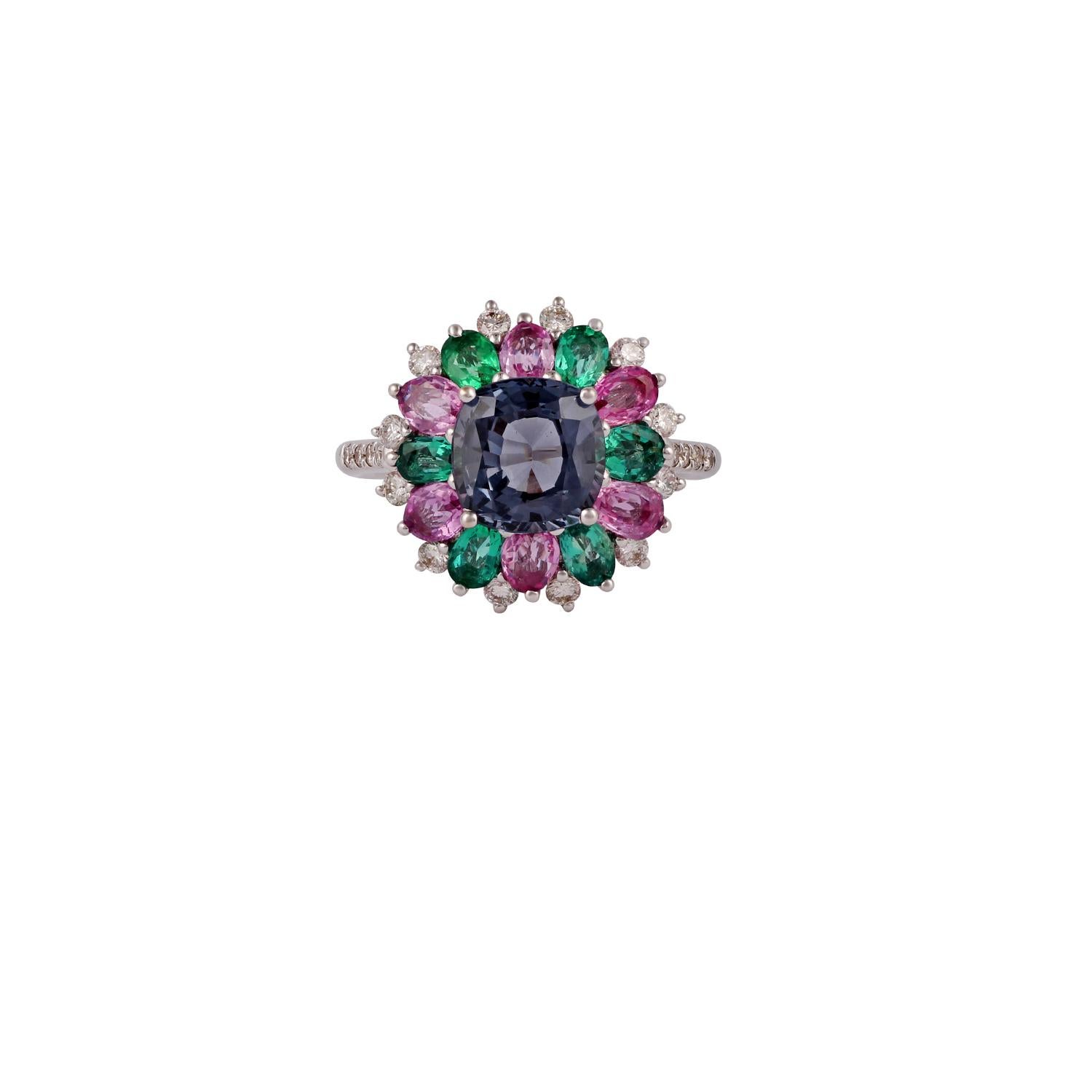 This is an elegant emerald, Multi Sapphire, Spinel & diamond ring studded in 18k gold with 6 piece of  emerald weight 0.81 Carat, 6 piece of Multi Sapphire 1.11 carat,  1 piece of Spinel 2.37 Carat. which is surrounded of mix shaped diamonds weight