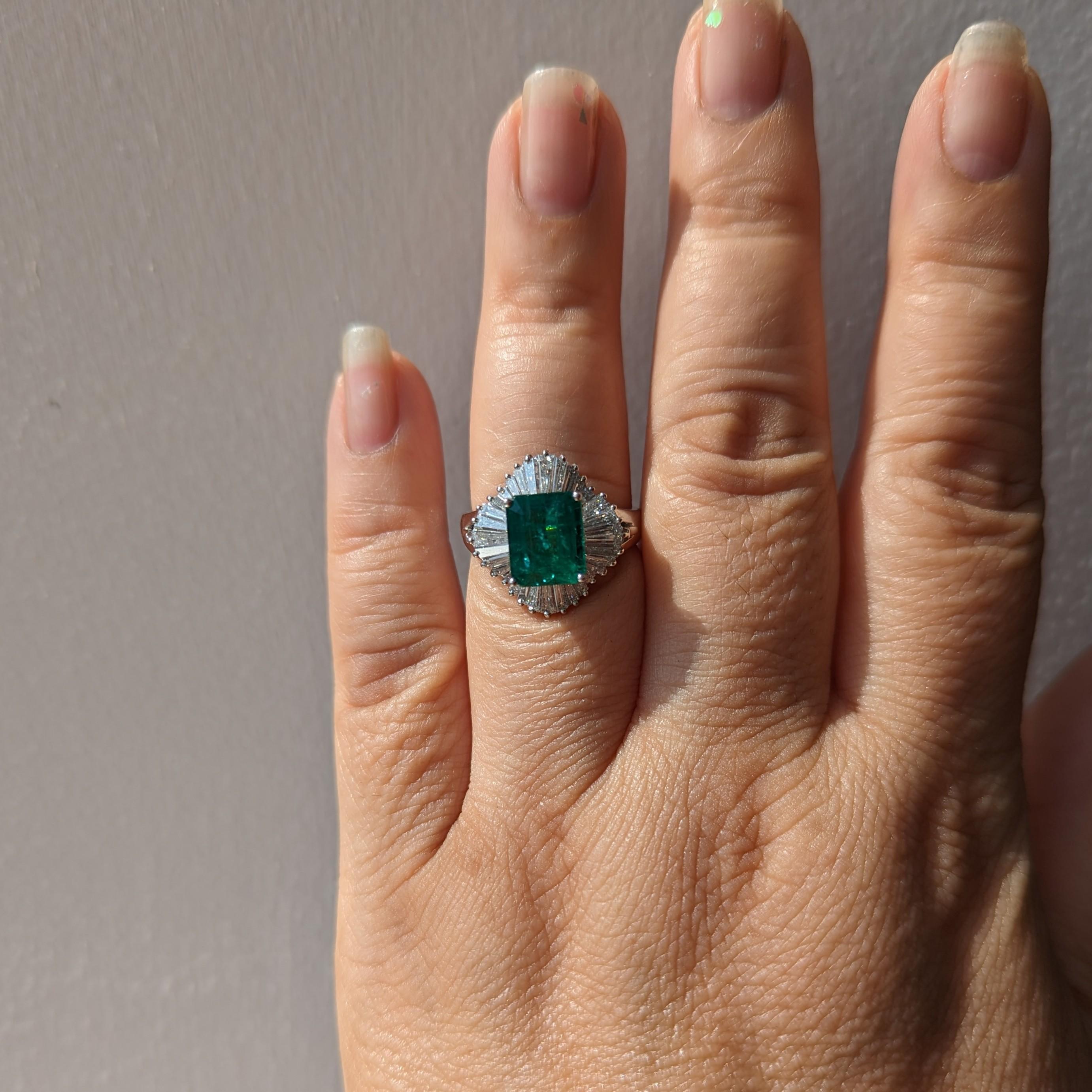 Gorgeous 2.97 ct. emerald octagon with 1.55 ct. good quality white diamond baguettes.  Handmade in platinum.  Ring size 8.