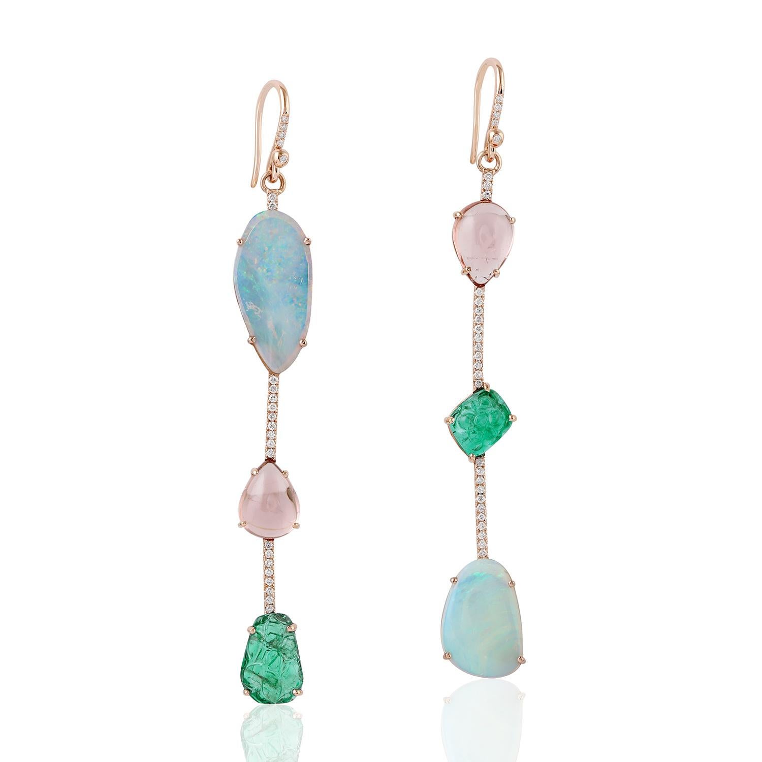 These beautiful linear drop earring are handcrafted in 18-karat gold. It is set with 4.25 carats Emerald, 4.57 carats Ethiopian opal, tourmaline and .31 carats of glimmering diamonds.

FOLLOW  MEGHNA JEWELS storefront to view the latest collection &