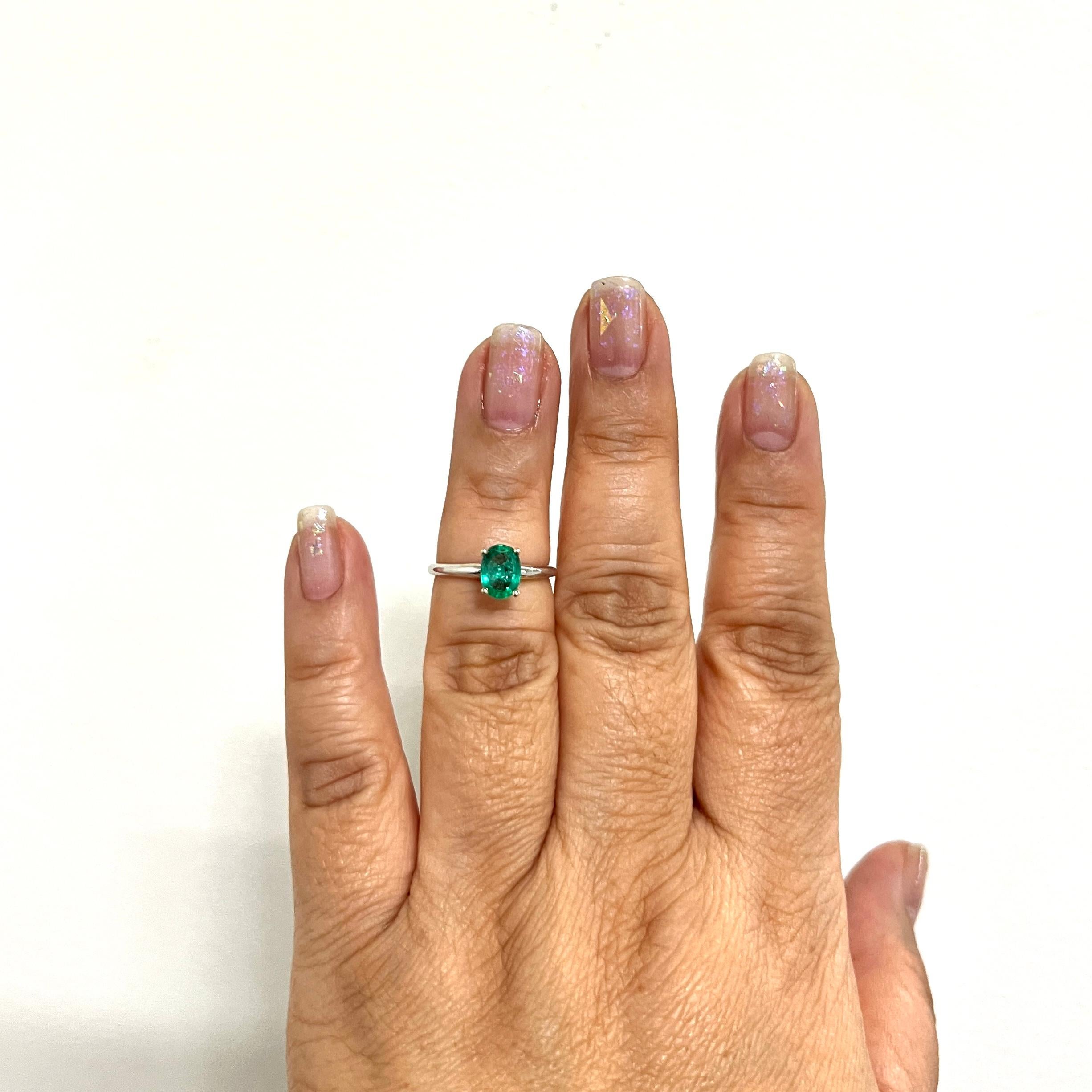 Beautiful 0.94 ct. emerald oval in a handmade 14k white gold ring.  Ring size 6.