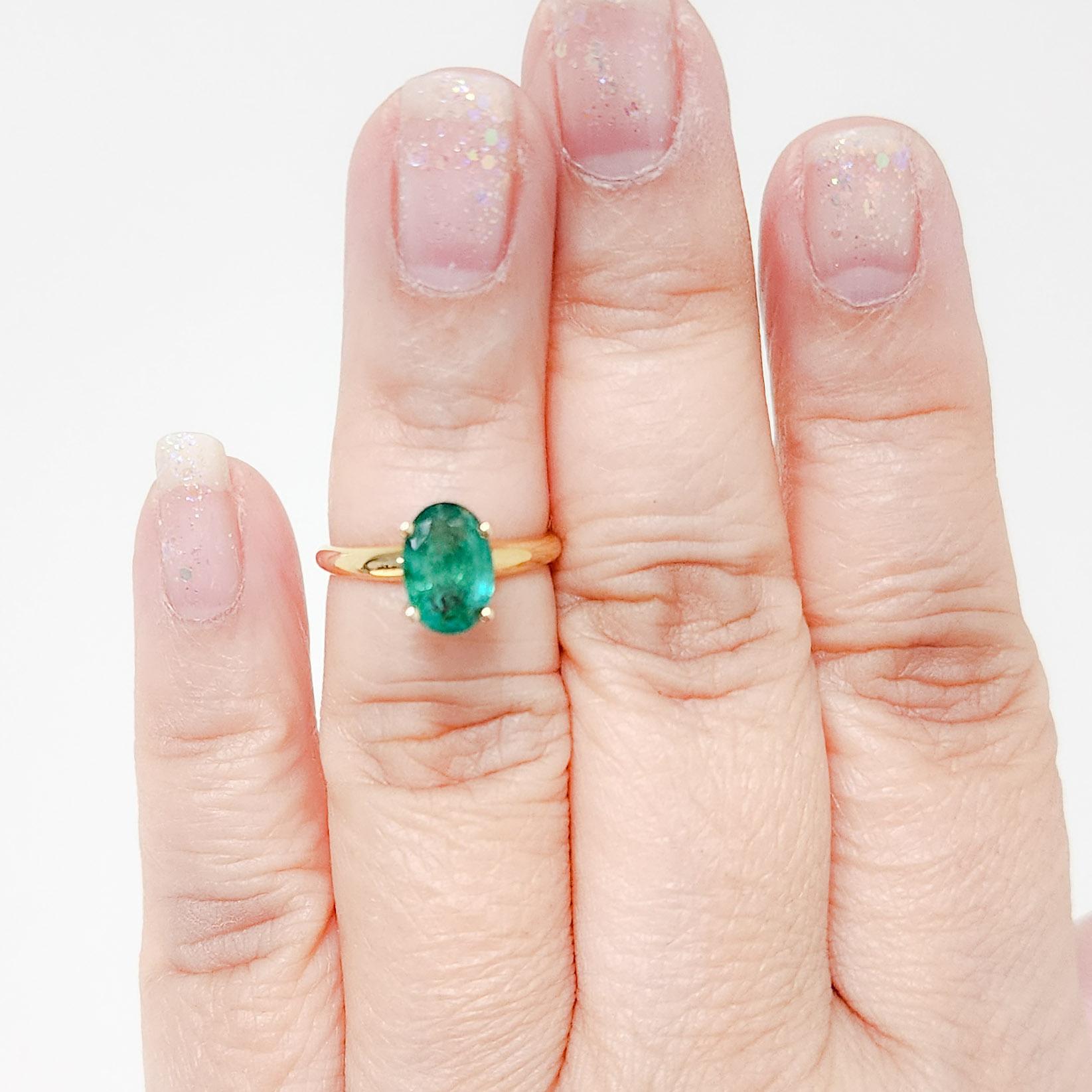 Beautiful 1.83 ct. emerald oval in a handmade 14k yellow gold ring.  Ring size 5.75.