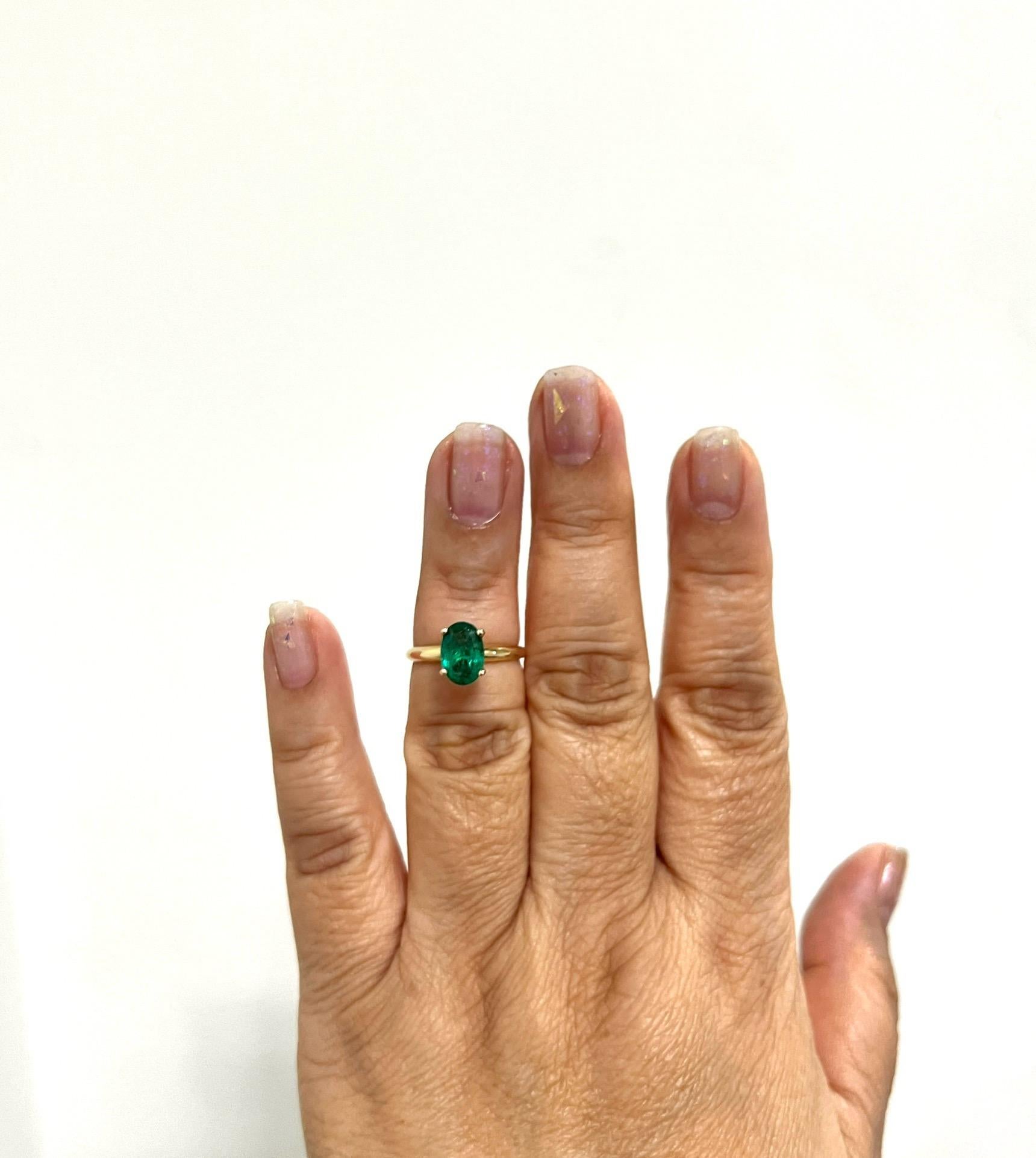 Beautiful 1.83 ct. emerald oval in a handmade 14k yellow gold ring.  Ring size 5.75.