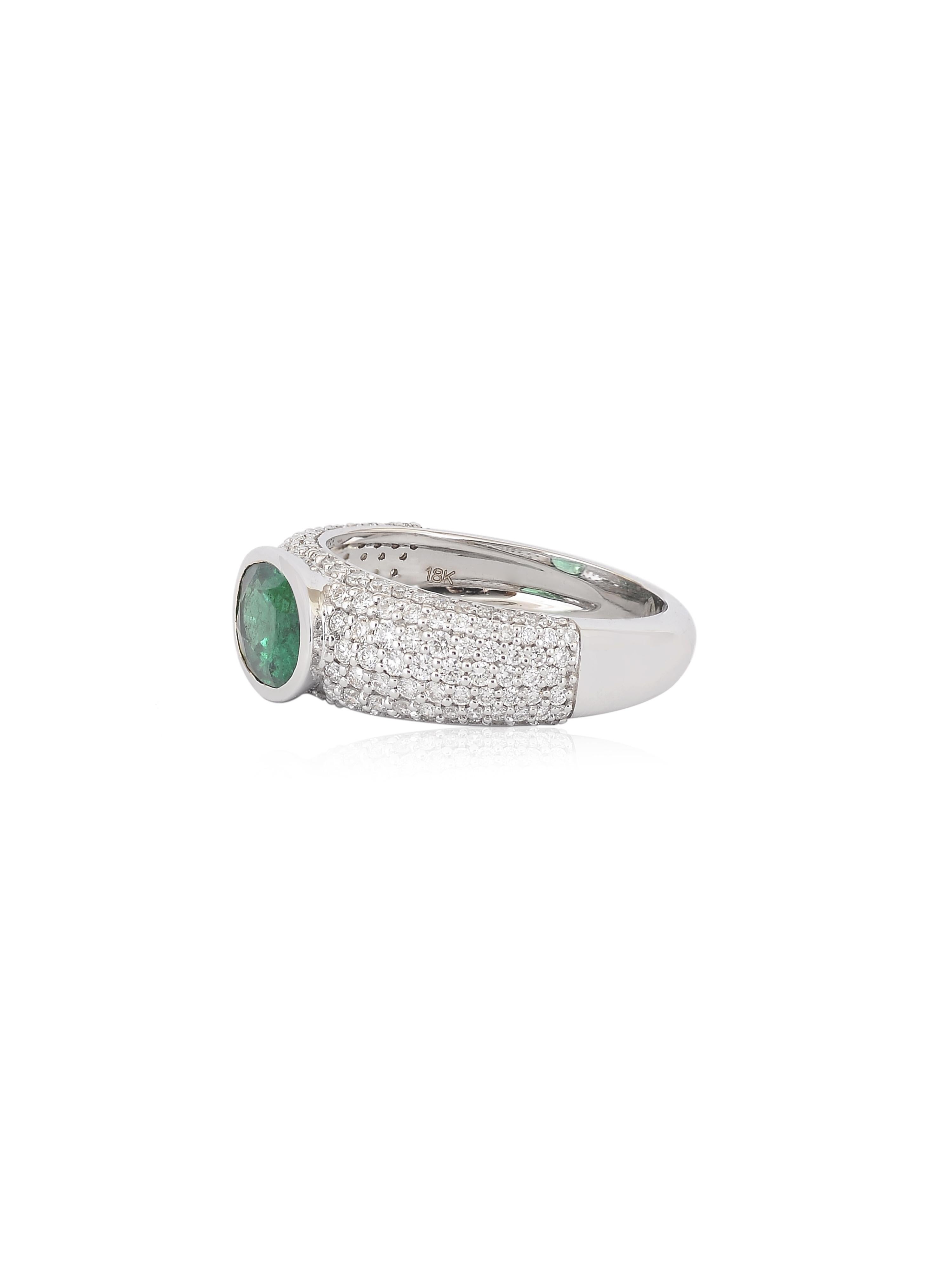 A white gold ring with a 1.60 carats Emerald cut stone in the centre and cluster of diamonds all around. The Emerald and white diamonds shine and sparkle when light falls on them. Its a piece that can be worn with all kinds of outfits and all