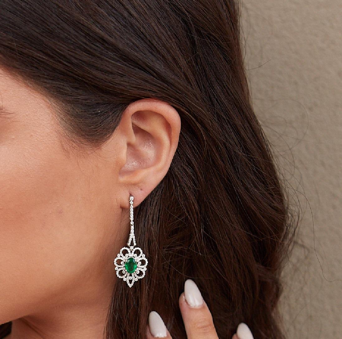 Tresor Diamond Earring features 1.27 cts diamond and 2.33 cts emerald in 18k white gold. The Earring are an ode to the luxurious yet classic beauty with sparkly diamonds. Their contemporary and modern design makes them versatile in their use. The