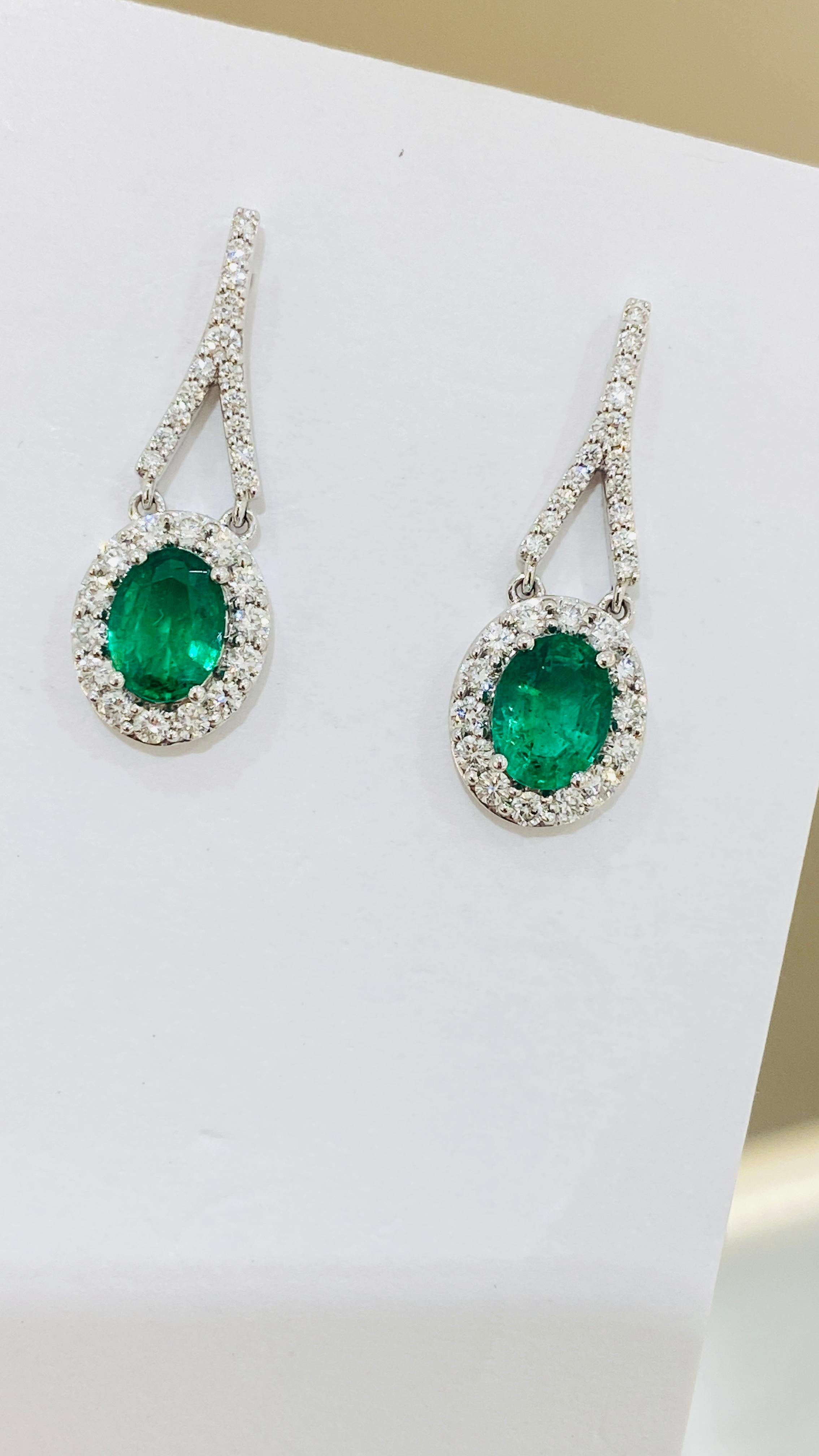 Contemporary Emerald Oval and Diamond Earring in 18K White Gold For Sale