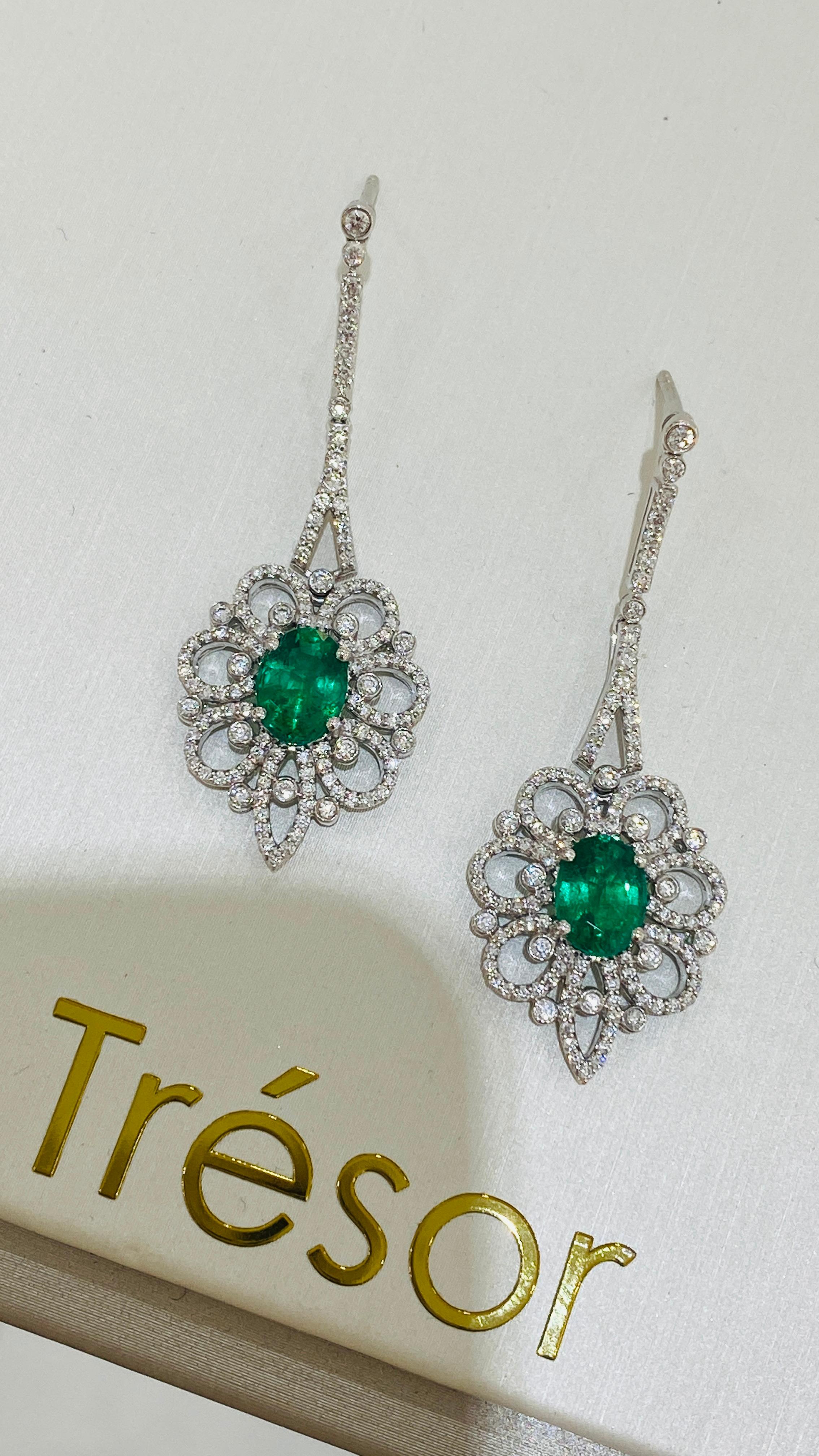 Oval Cut Emerald Oval and Diamond Earring in 18K White Gold For Sale