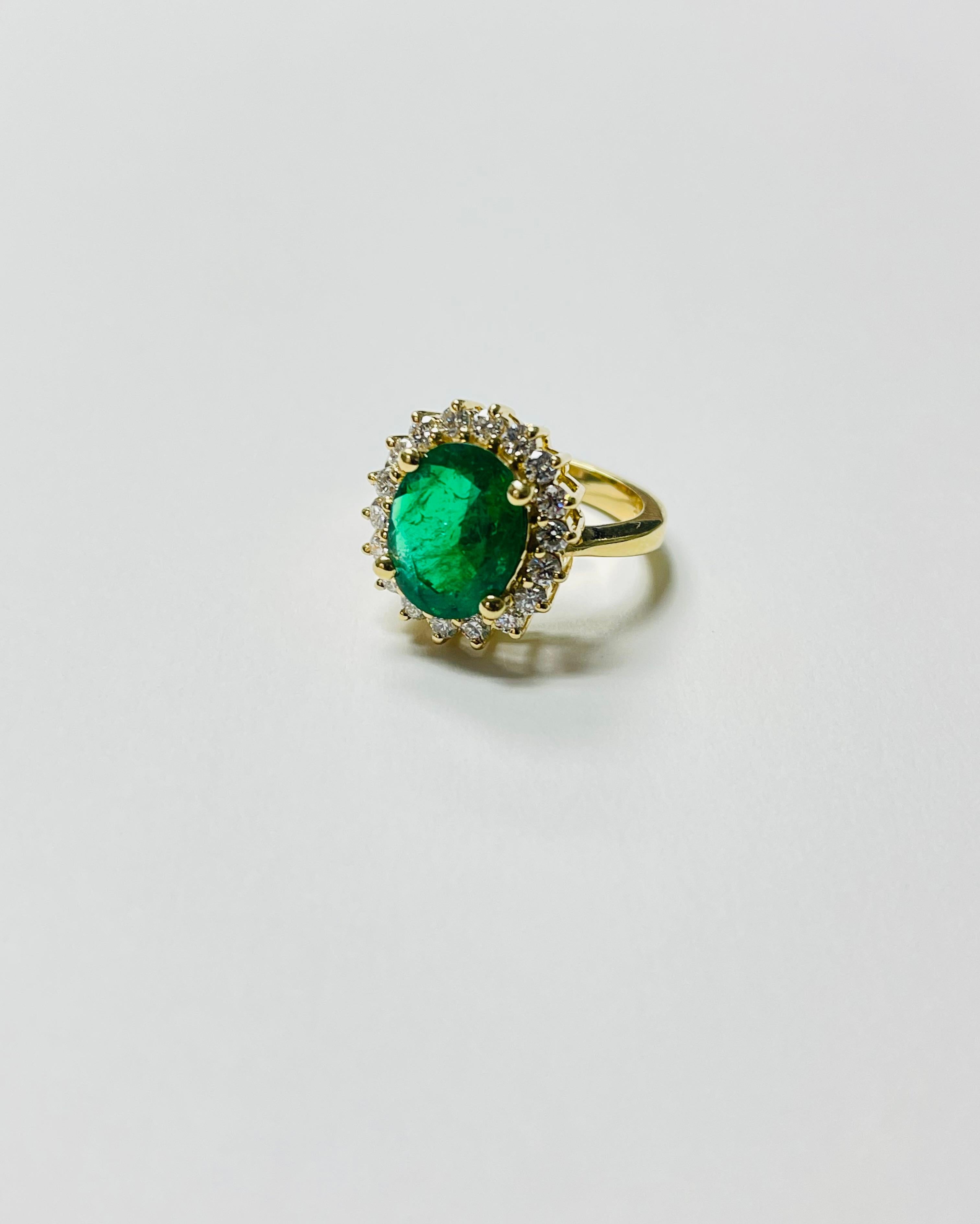 Contemporary Emerald Oval And Diamond Engagement Ring In 18 Karat Yellow Gold. For Sale