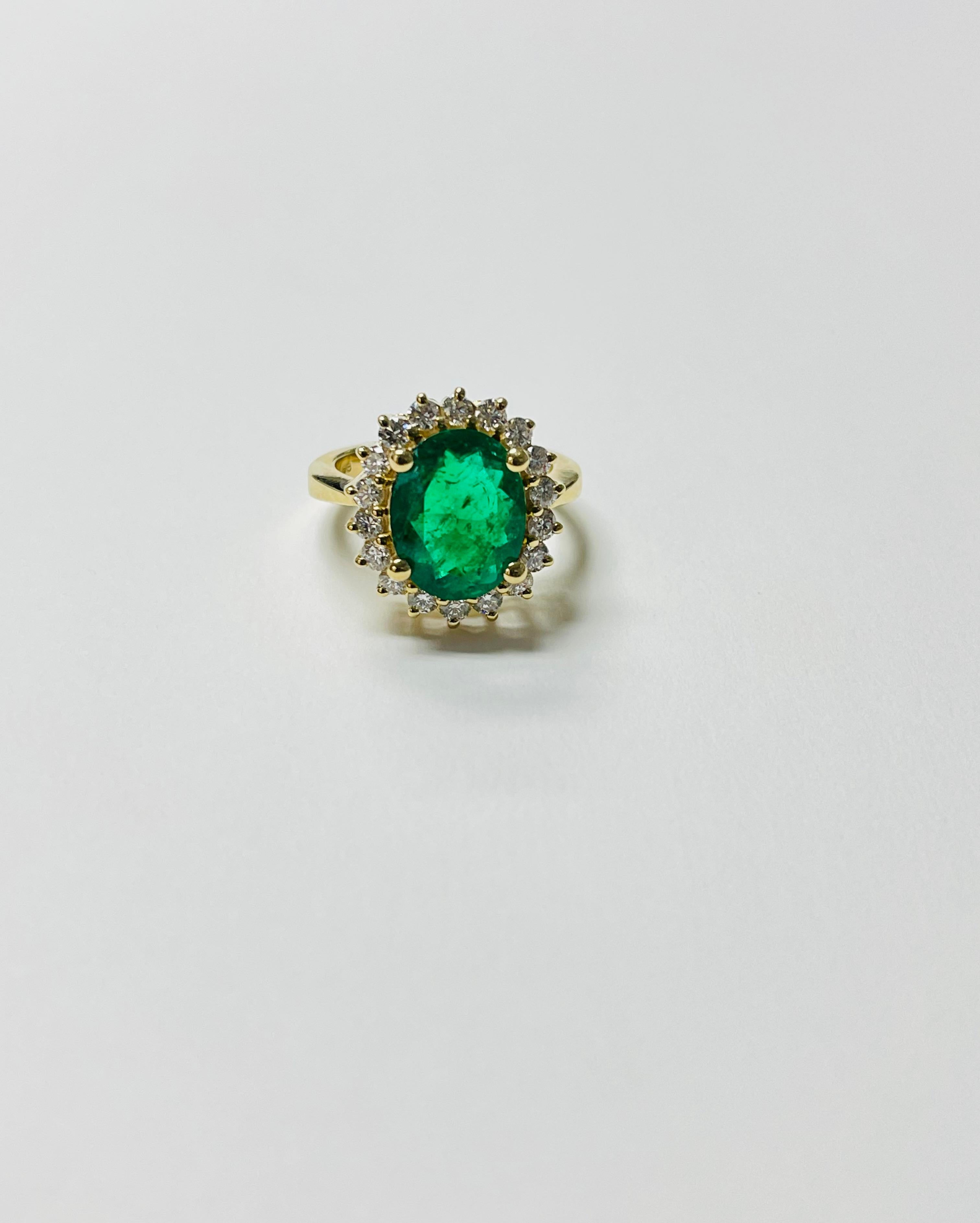 Oval Cut Emerald Oval And Diamond Engagement Ring In 18 Karat Yellow Gold. For Sale