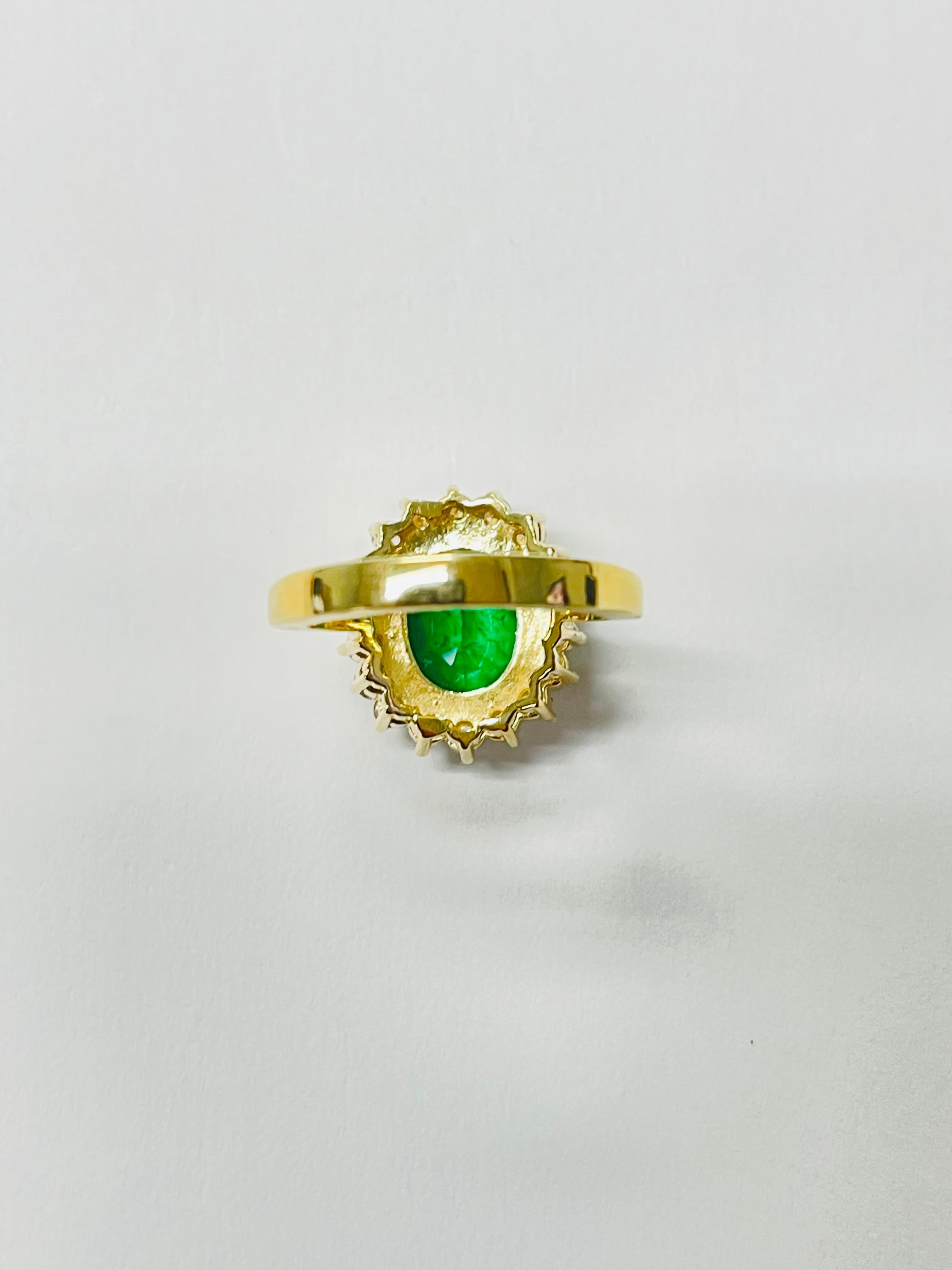 Women's Emerald Oval And Diamond Engagement Ring In 18 Karat Yellow Gold. For Sale