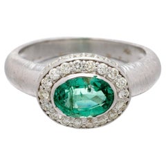 Emerald oval and Diamond Engagement Ring In 18K White Gold. 