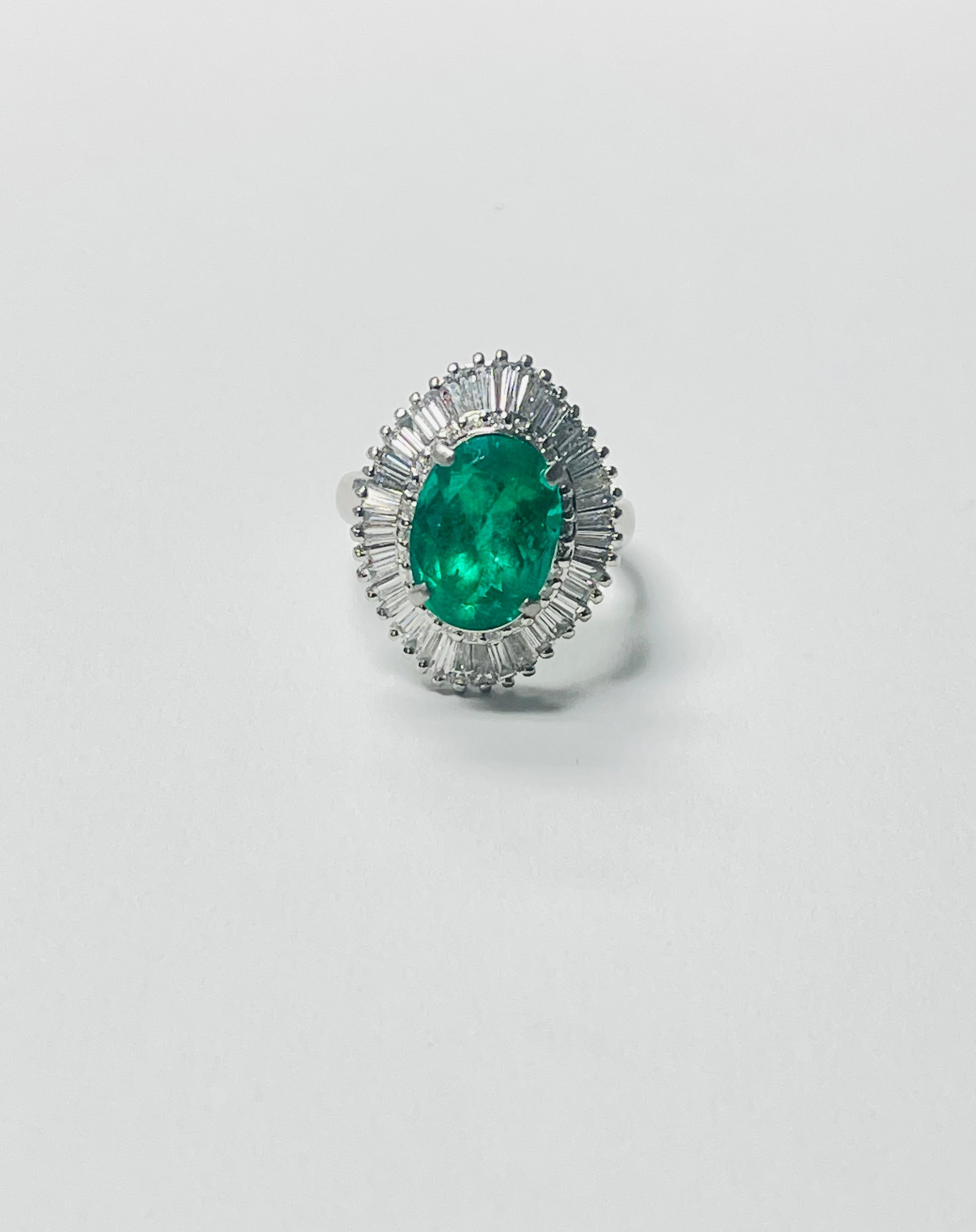 Oval Emerald and Diamond Engagement Ring beautifully handcrafted in 18 karat gold. 

The details are as follows : 

Oval Emerald weight : 4.21 carats 
Diamond weight : 2 carats ( G color and VS clarity ) 
Metal : 18 Karat White Gold 
Ring size : 6 
