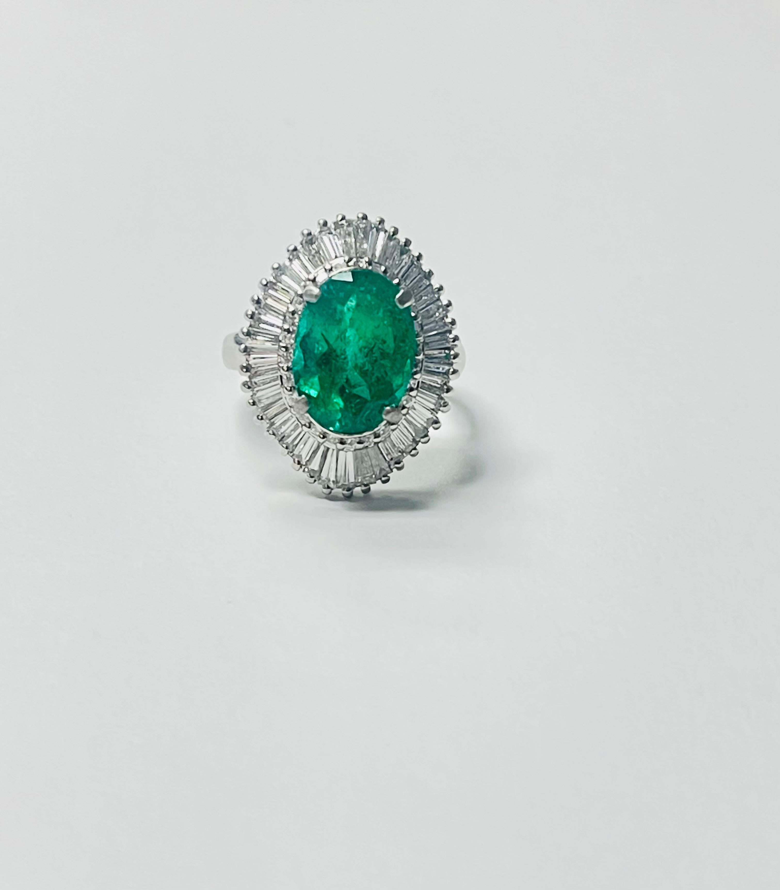 Oval Cut Emerald Oval and Diamond Engagement Ring In Gold. For Sale