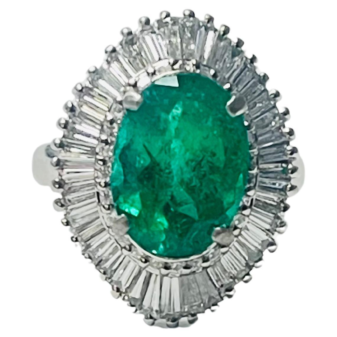 Emerald Oval and Diamond Engagement Ring In Gold.
