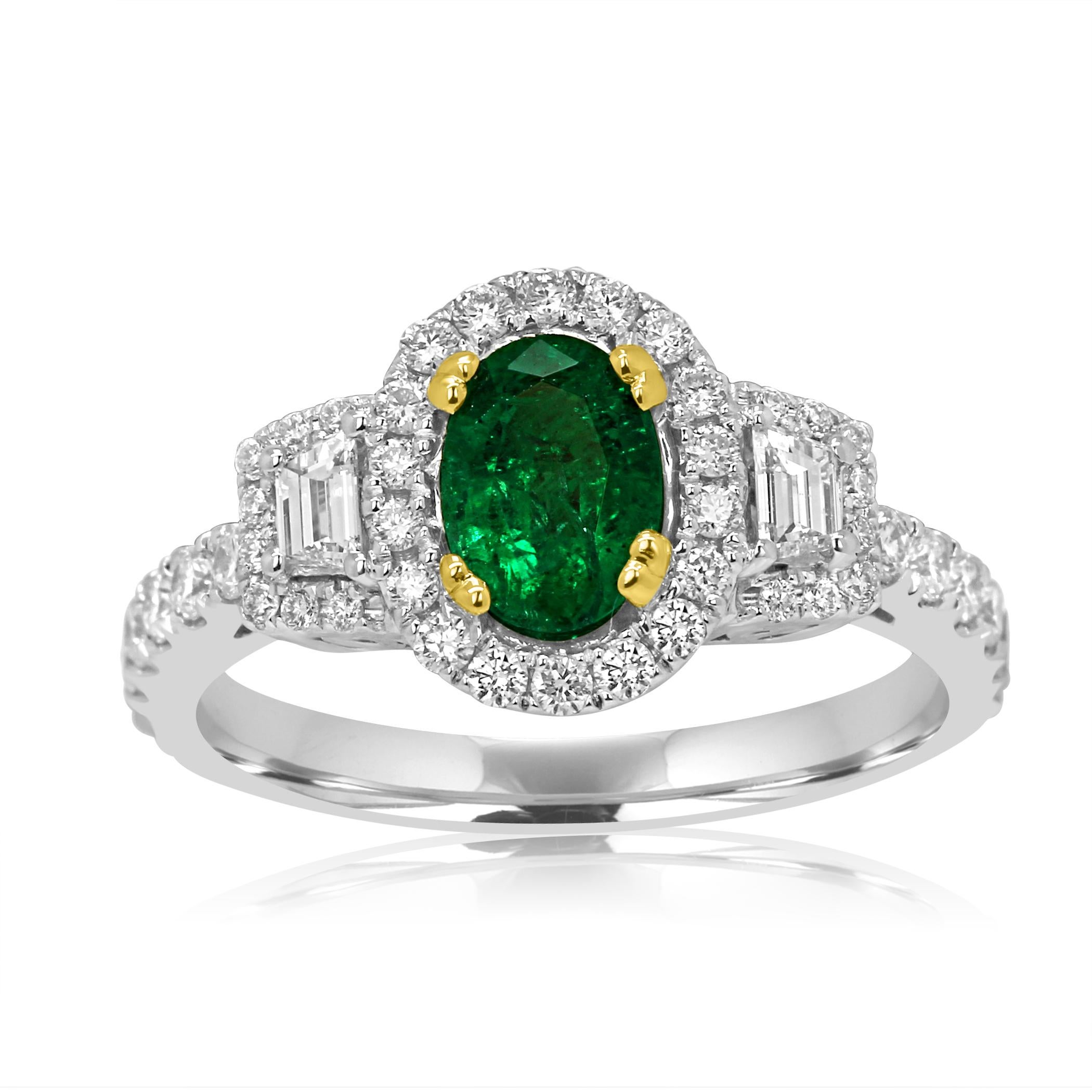 Gorgeous Emerald Oval 0.80 Carat encircled in a single Halo of White Round Diamonds 0.37 Carat Flanked with 2 White Diamond Trapezoids on the side 0.16 Carat in 14K White and Yellow Gold Thee Stone Cocktail Ring.

Total Stone Weight 1.33