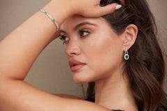 Emerald Oval And Diamond Round Earring In 18K White Gold