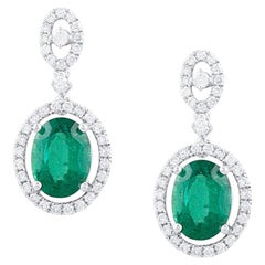 Emerald Oval And Diamond Round Earring In 18K White Gold