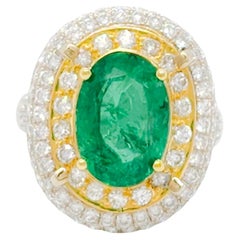Emerald Oval and Double Halo White Diamond Cocktail Ring in 14k