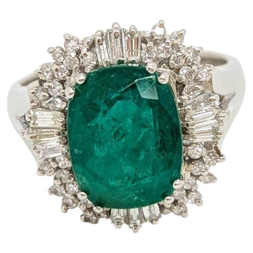 Emerald Oval and White Diamond Cluster Ring in Platinum For Sale