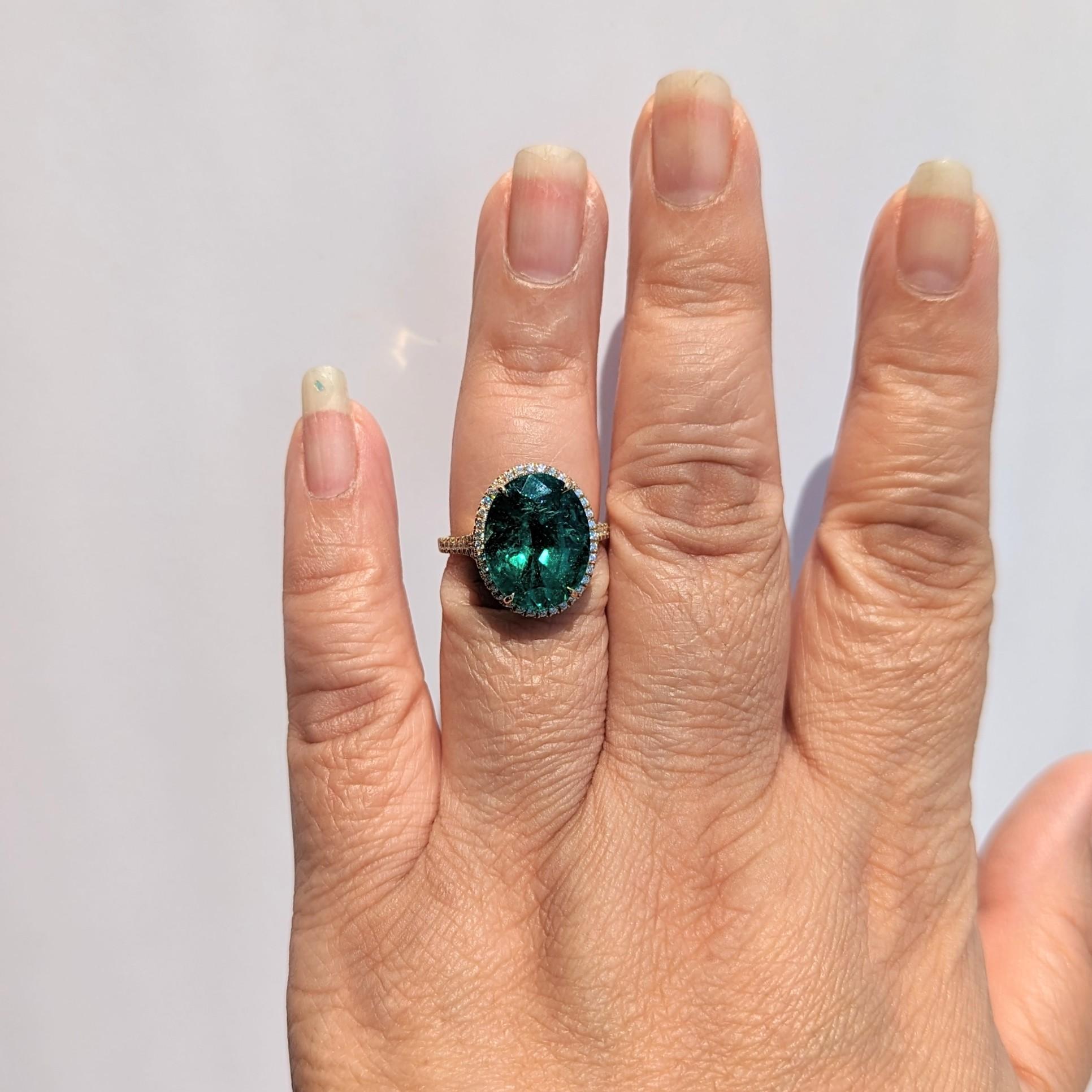 Beautiful 8.42 ct. emerald oval with 0.51 ct. good quality white diamond rounds.  Handmade in 18k yellow gold.  Ring size 6.5.
