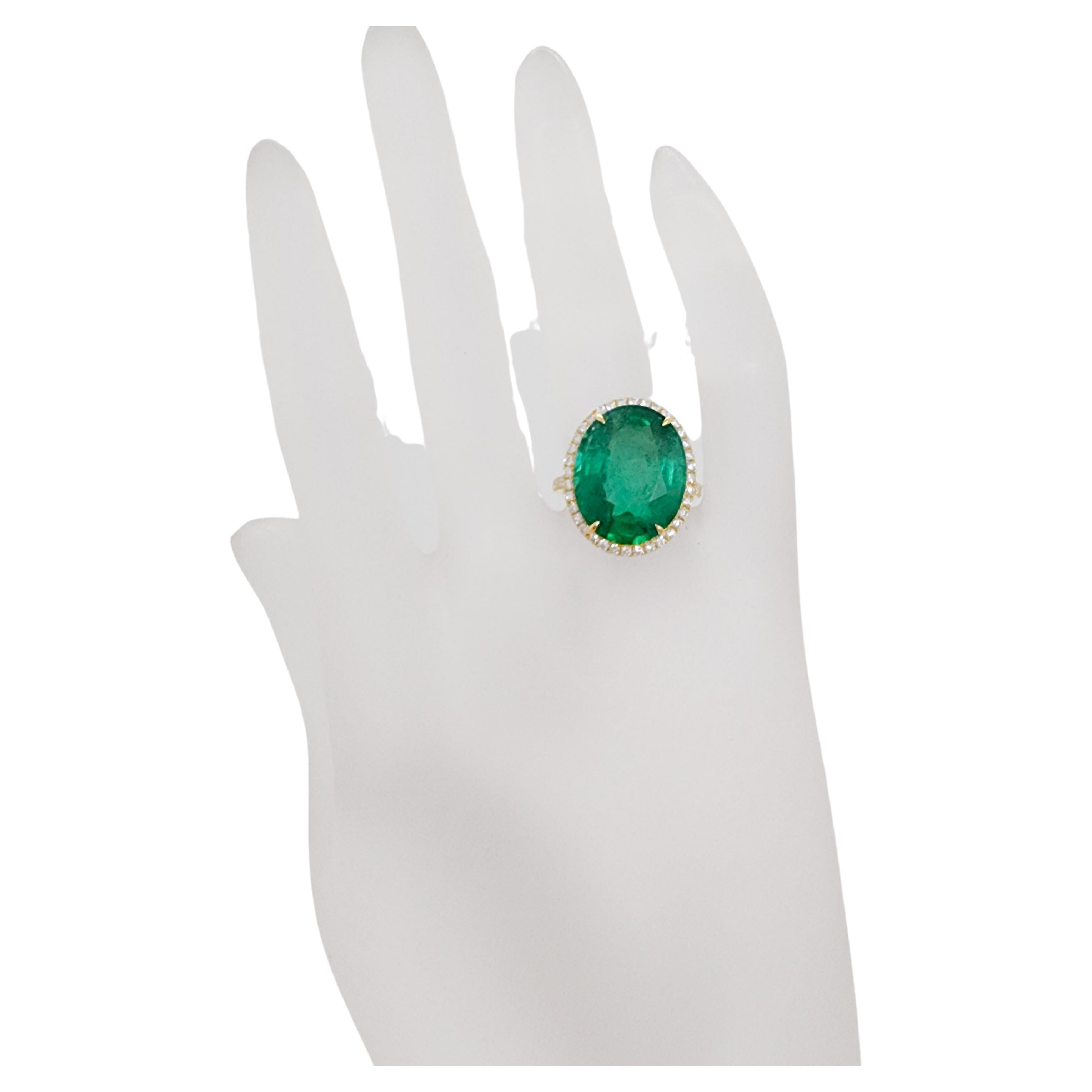 Absolutely gorgeous 10.68 ct. emerald oval with 0.90 ct. good quality, white, and bright diamond rounds.  Handmade in 18k yellow gold.  Ring size 6.25.