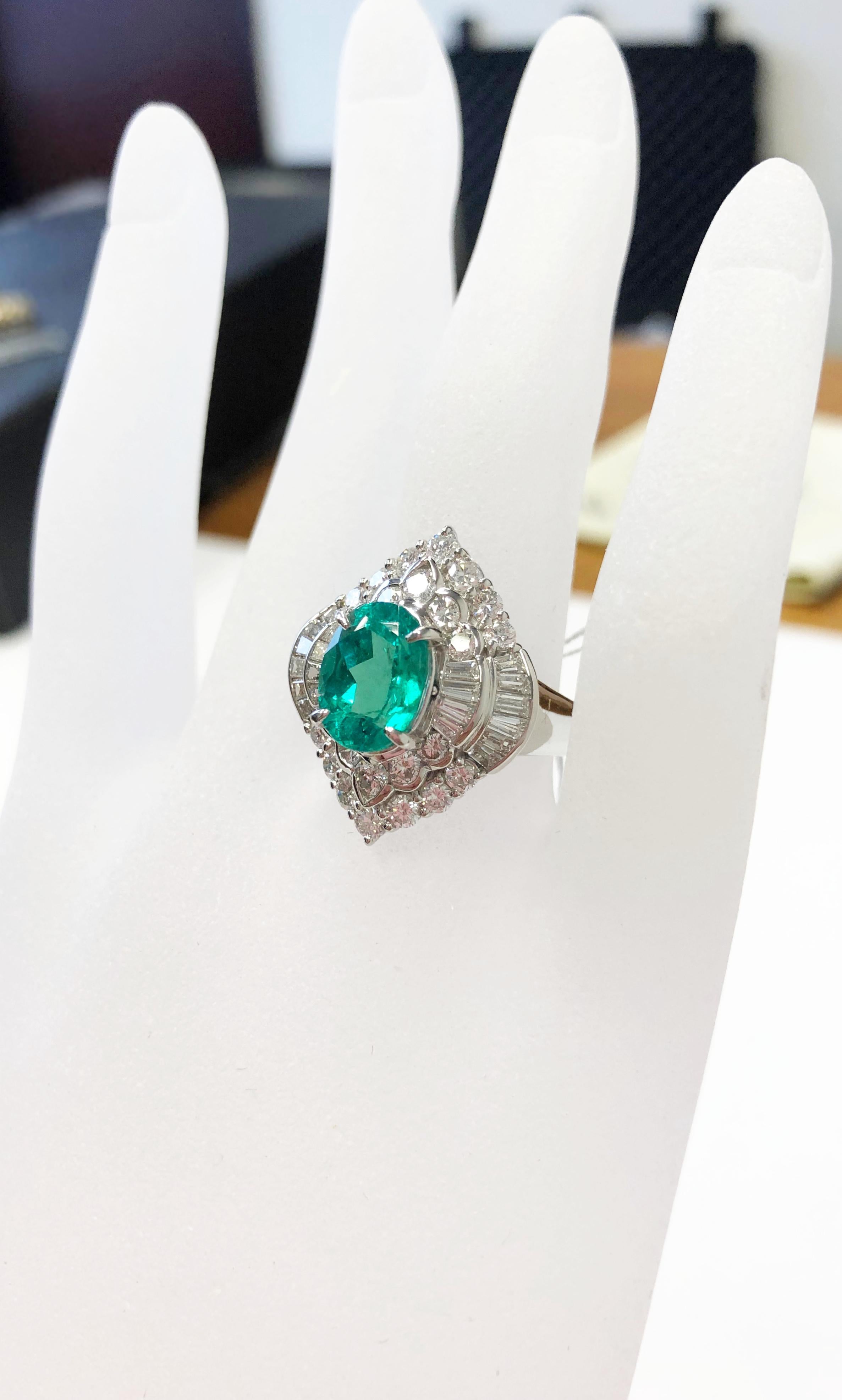 Oval Cut Emerald Oval and White Diamond Cocktail Ring in Platinum