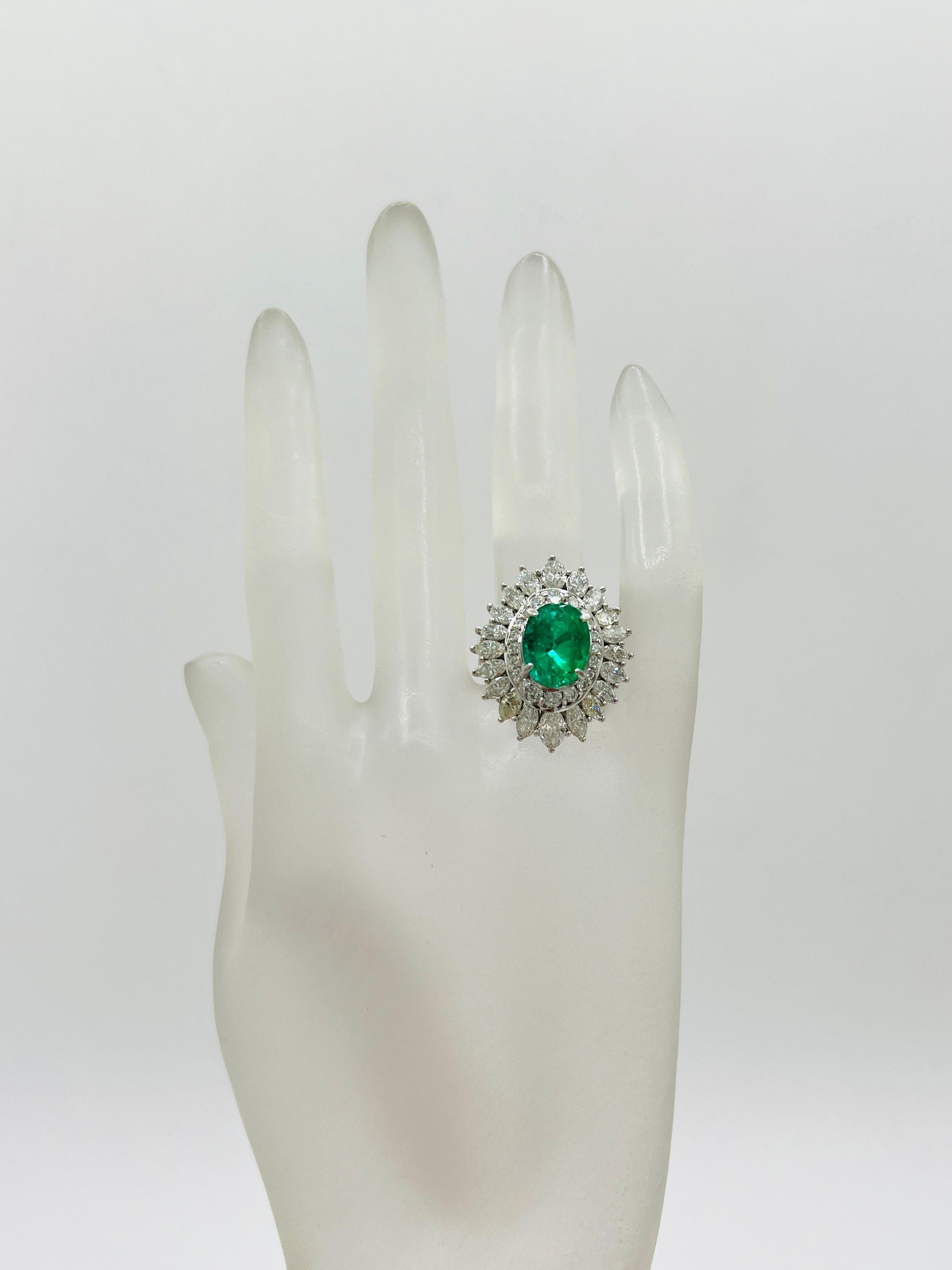 Oval Cut Colombian Emerald Oval and White Diamond Marquise Ring in Platinum