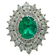 Colombian Emerald Oval and White Diamond Marquise Ring in Platinum