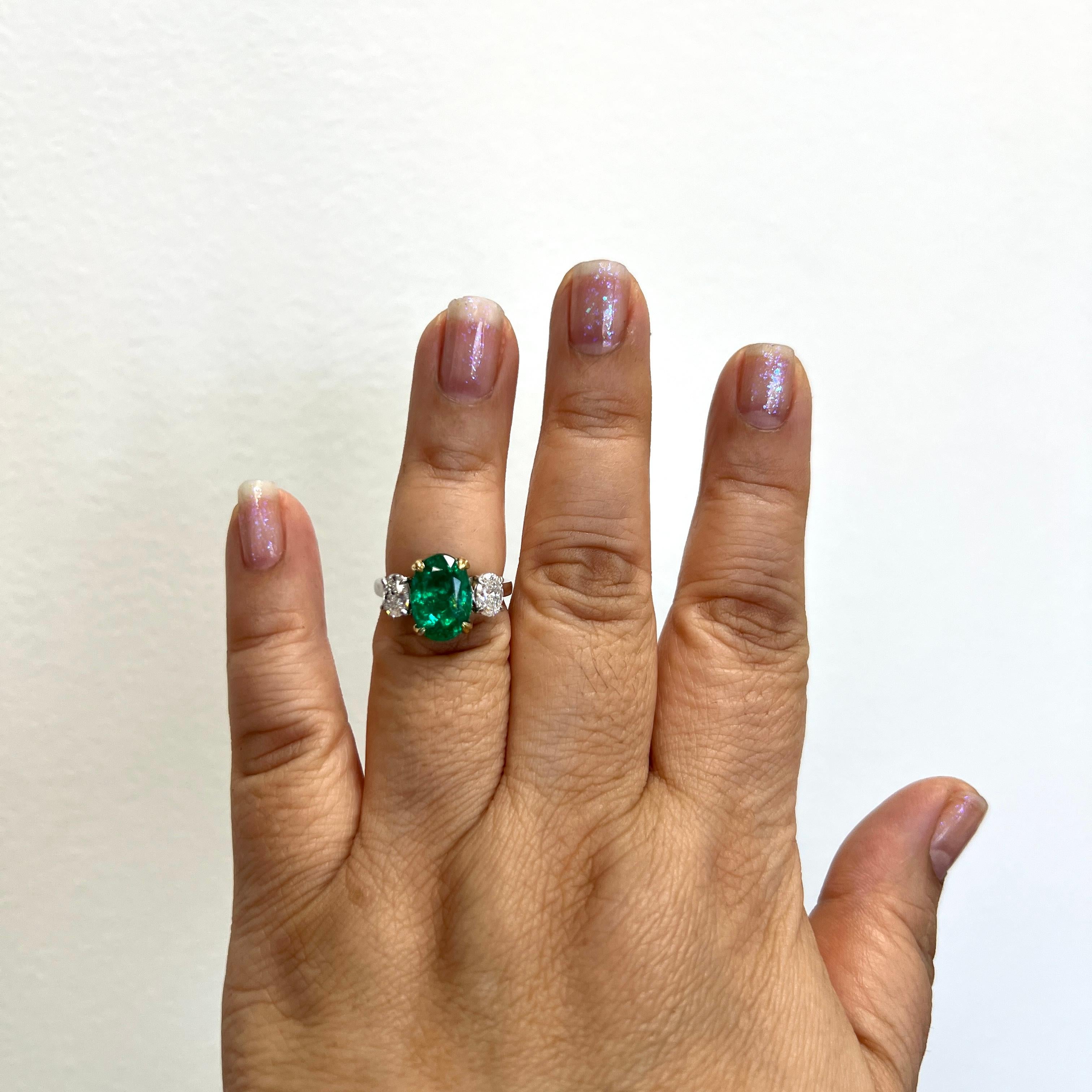 Stunning 4.06 ct. bright emerald oval with 1.00 ct. GH SI2 white diamond ovals.  Handmade in 18k yellow gold and platinum.  Ring size 6.5.  GIA certificates included.