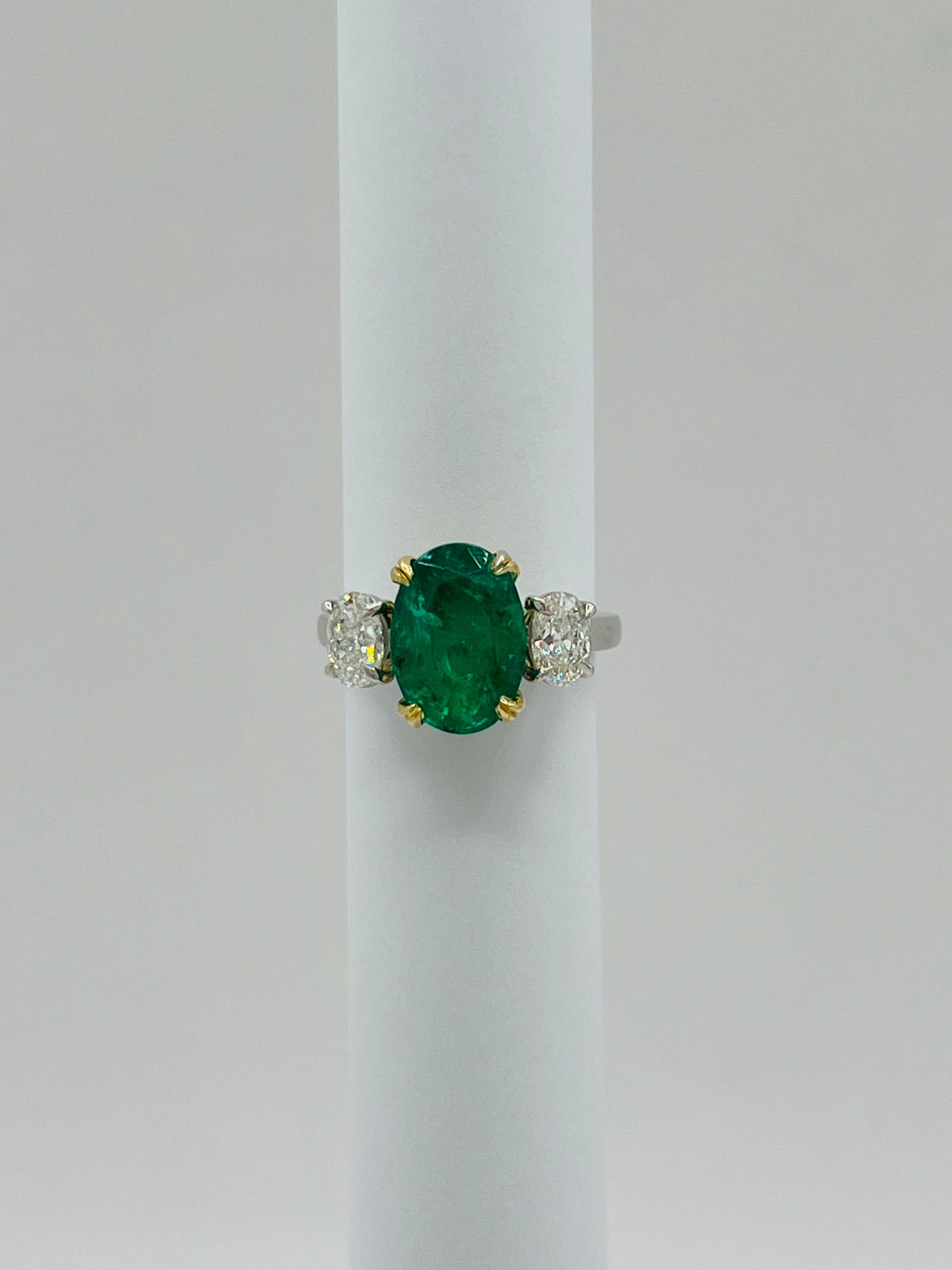 Oval Cut Emerald Oval and White Diamond Oval Three Stone Ring in Platinum & 18K Gold For Sale