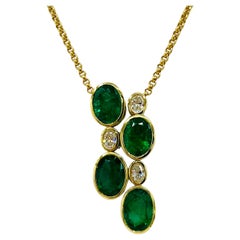 Emerald Oval and White Diamond Pendant Necklace in 18K Yellow Gold