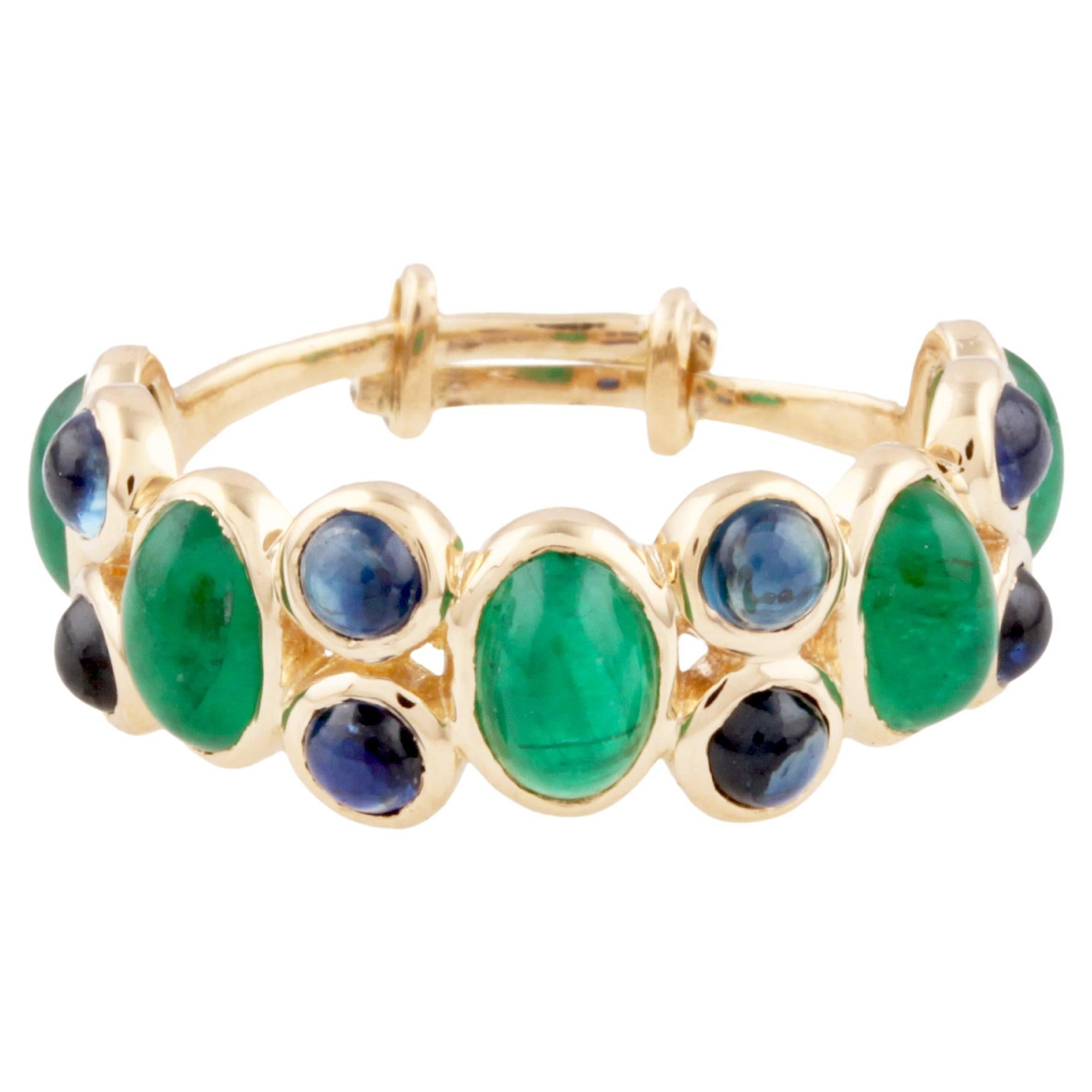 Ovaler Smaragd & runder blauer Saphir Ring aus 18K Gelbgold