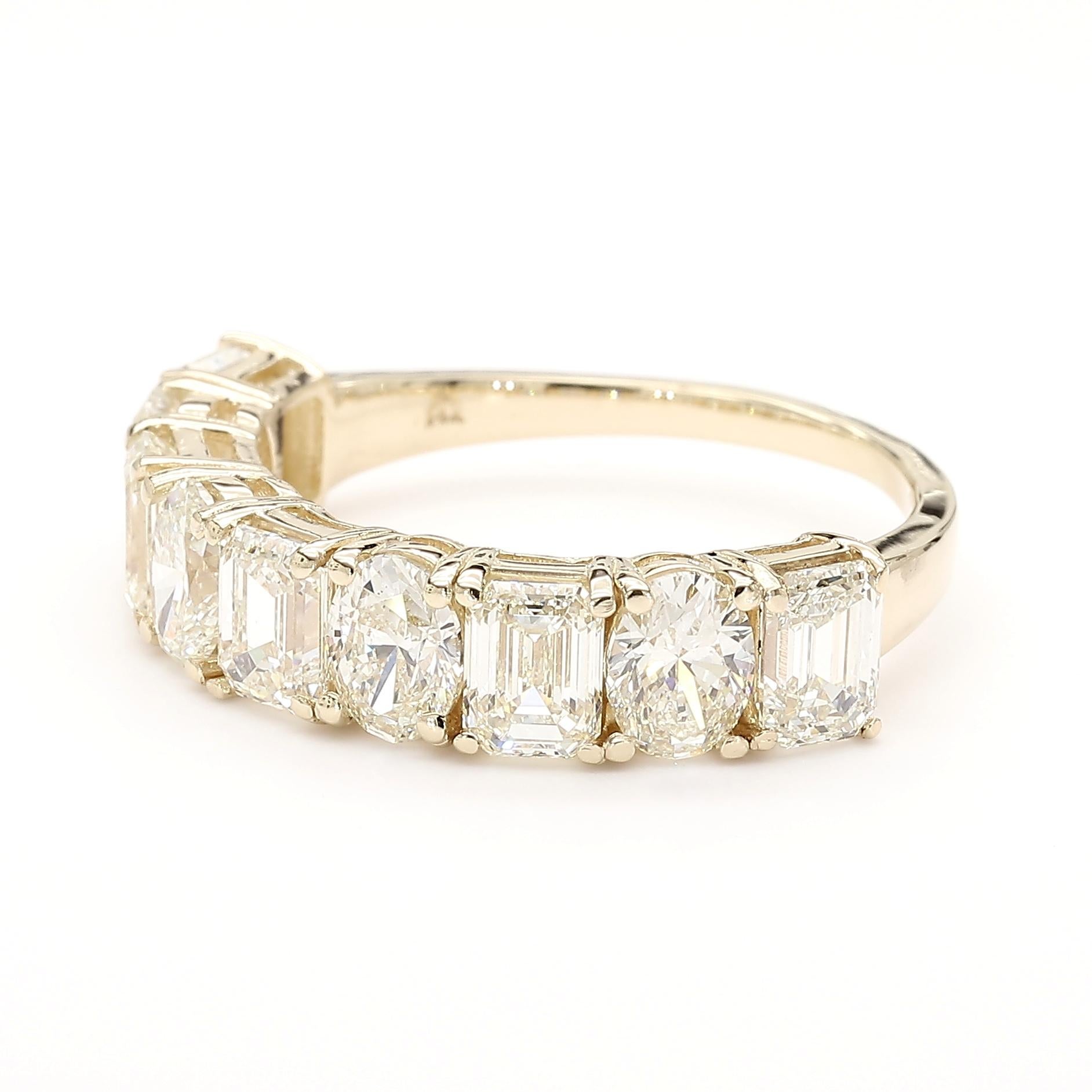 This very impressive alternating *Emerald & Oval Cut* Halfway Eternity Diamond Ring is a testament to fine craftsmanship and timeless design. Perfect for those who appreciate the beauty of natural diamonds, this ring offers a balance of luxury and