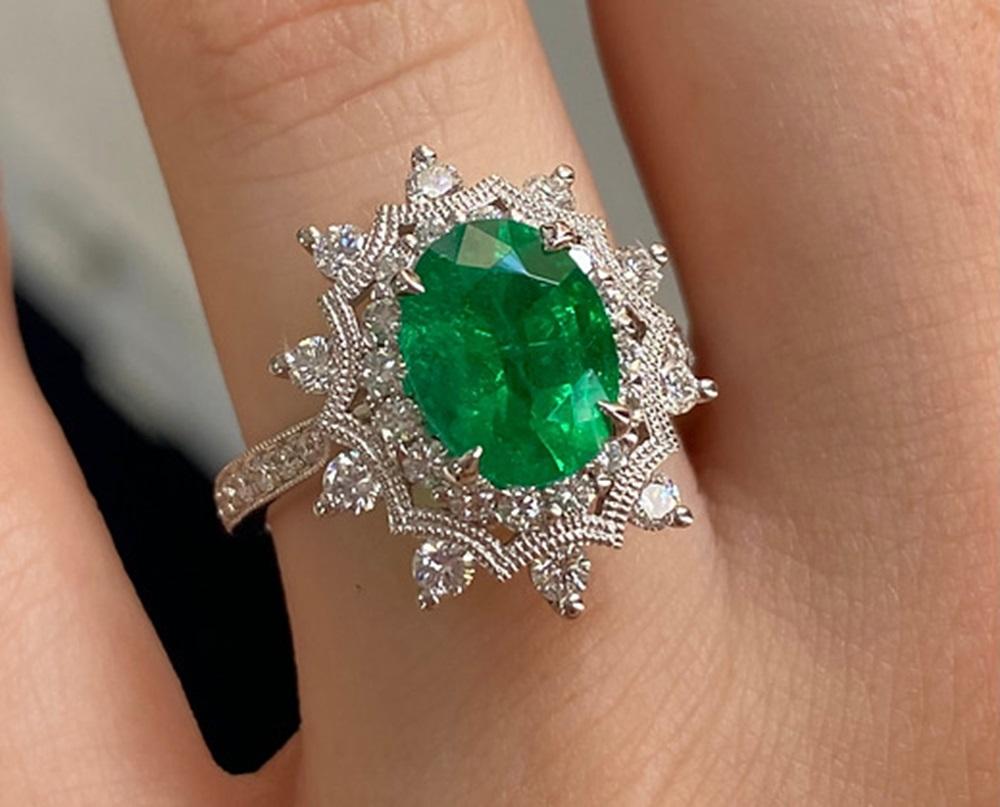 Emerald Weight: 2.34 CTS, Measurements: 10 x 7.7 mm, Diamond Weight: 0.95 CTS, Metal: 18K White Gold, Ring Size: 6.5, Shape: Oval, Color: Green, Hardness: 7.5-8, Birthstone: May