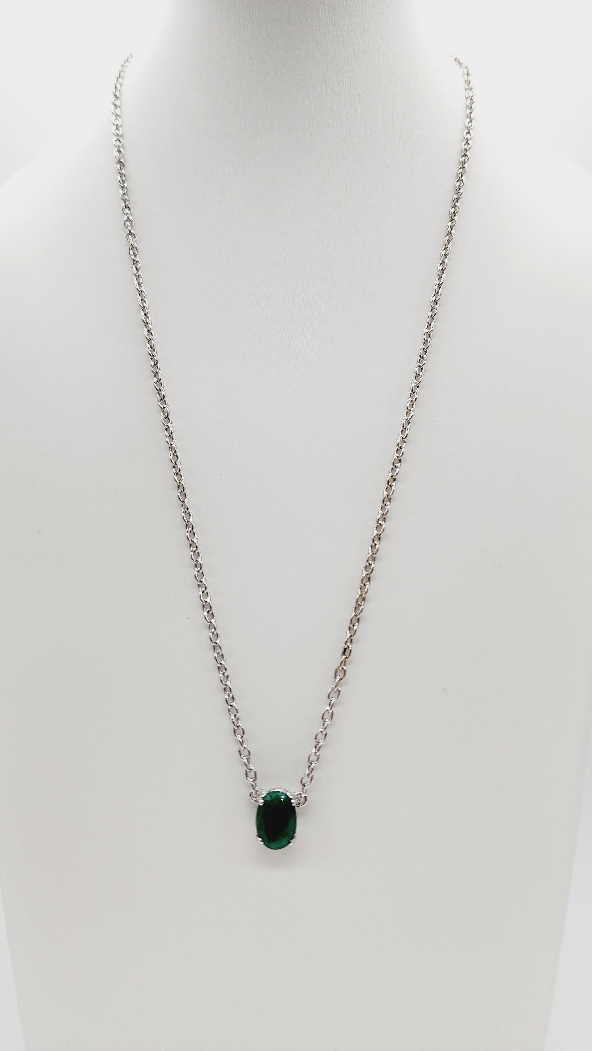Brilliant and beautiful. 14 Karat White Gold Necklace. Oval Shape Emerald Center. Insert clasp closure with safety secure latch. Elegance you can wear everyday.

Center emerald weight: 2.18 carats 
Setting type: 14k White gold
Length: 20