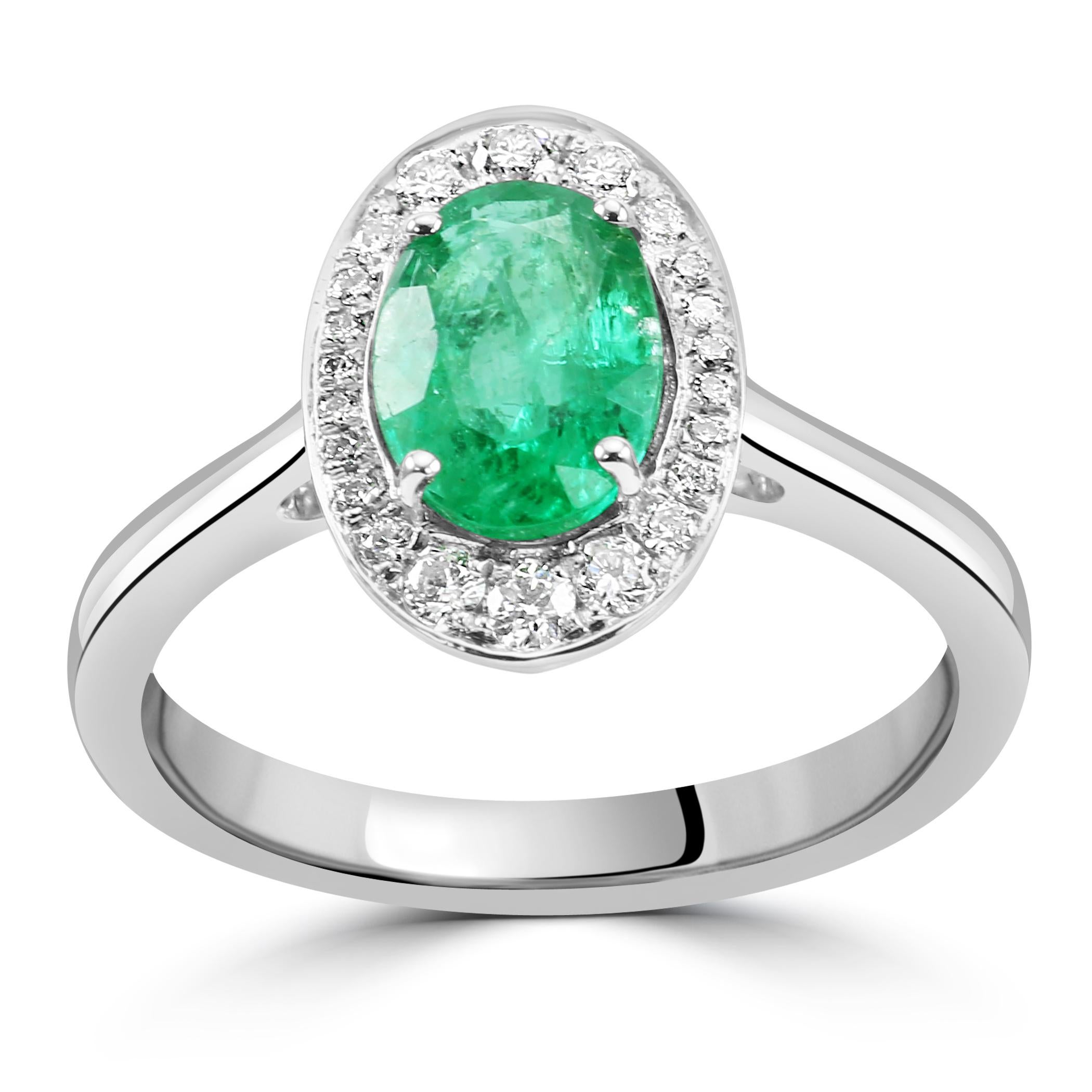 The focal point of the ring is the stunning Oval-Shaped Emerald, chosen for its rich color and graceful shape. With a weight of 1.2 carats, the emerald exudes a lush green hue, symbolizing renewal and abundance.

Encircling the emerald like a halo
