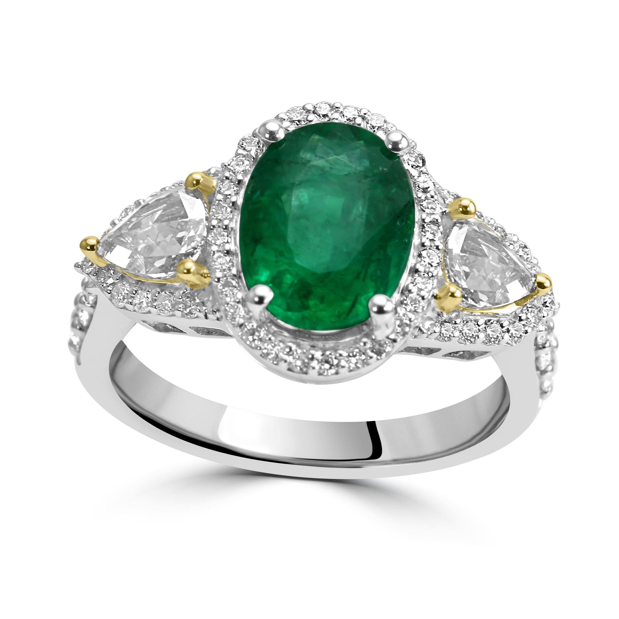 This Emerald ring is a dazzling showcase of natural beauty and exceptional craftsmanship.

At its heart is a jaw dropping Oval-Shaped Emerald, weighing at 1.95 carats, This ring is a symphony of vibrant color, sparkle, and elegance. 

Surrounding