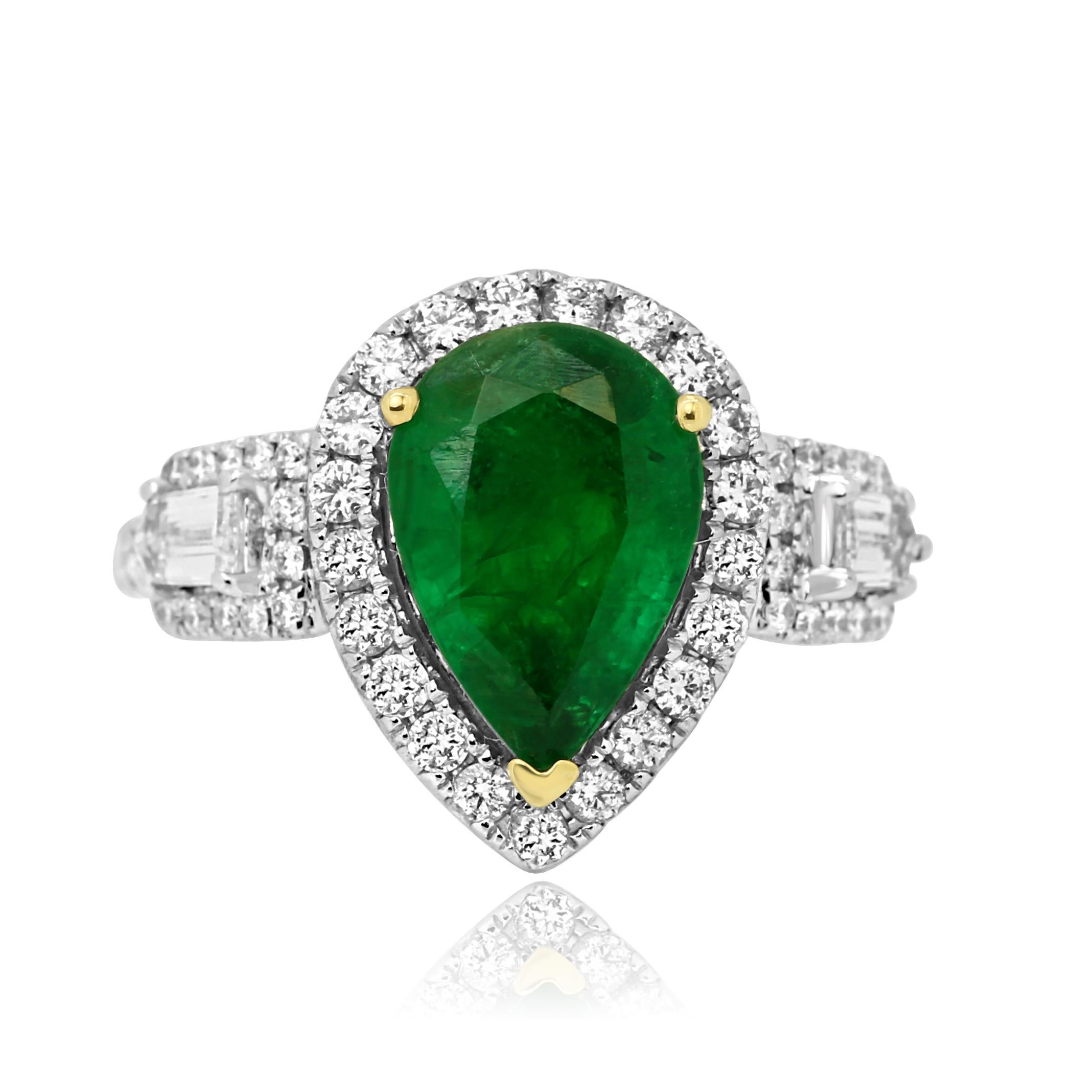 Gorgeous Emerald Pear 2.78 Carat Flanked With 2 Colorless VS-SI Diamond Bullet Shape 0.24 Carat Encircled in Single Halo of Colorless VS-SI Diamond Rounds 0.74 Carat Stunning 14K White and Yellow Gold Three Stone Bridal Fashion Ring.
TOTAL WEIGHT