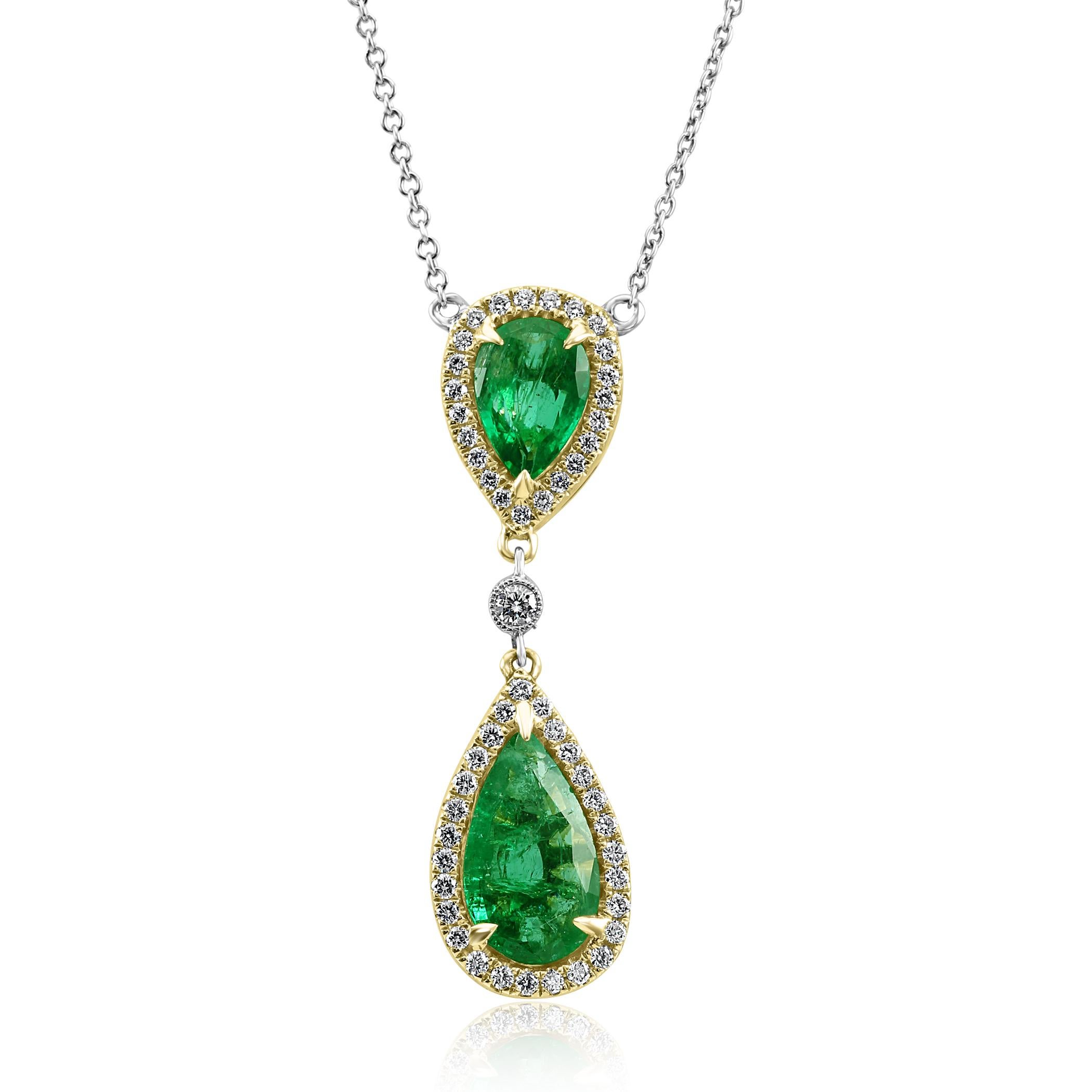Stunning 2 Natural Zambian Emerald Pears 3.54 Carat Encircled in Double Halo of White G-H Color VS-SI Clarity Diamond Rounds 0.90 Carat in 14K White and Yellow Gold Drop Pendant Diamond By Yard Chain Chic and Stylish Necklace.

Total Weight 4.44