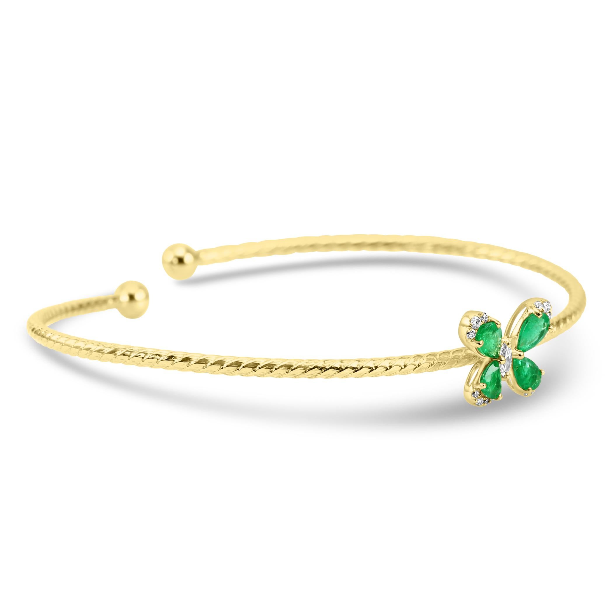 Elevate your style with our exquisite fashion flexible bangle, featuring a gracefully designed shape of a butterfly. 

The center piece of this bangle is the captivating Marquise-cut Emerald, known for its unique shape and vibrant green hue.