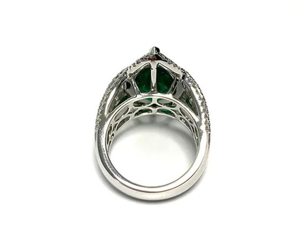 Emerald Weight: 7.06 cts, Diamond Weight: 2.38 cts, Metal: 18K white gold, Ring Size: 6.25, Shape: Pear, Color: Green, Hardness: 7.5-8, Birthstone: May