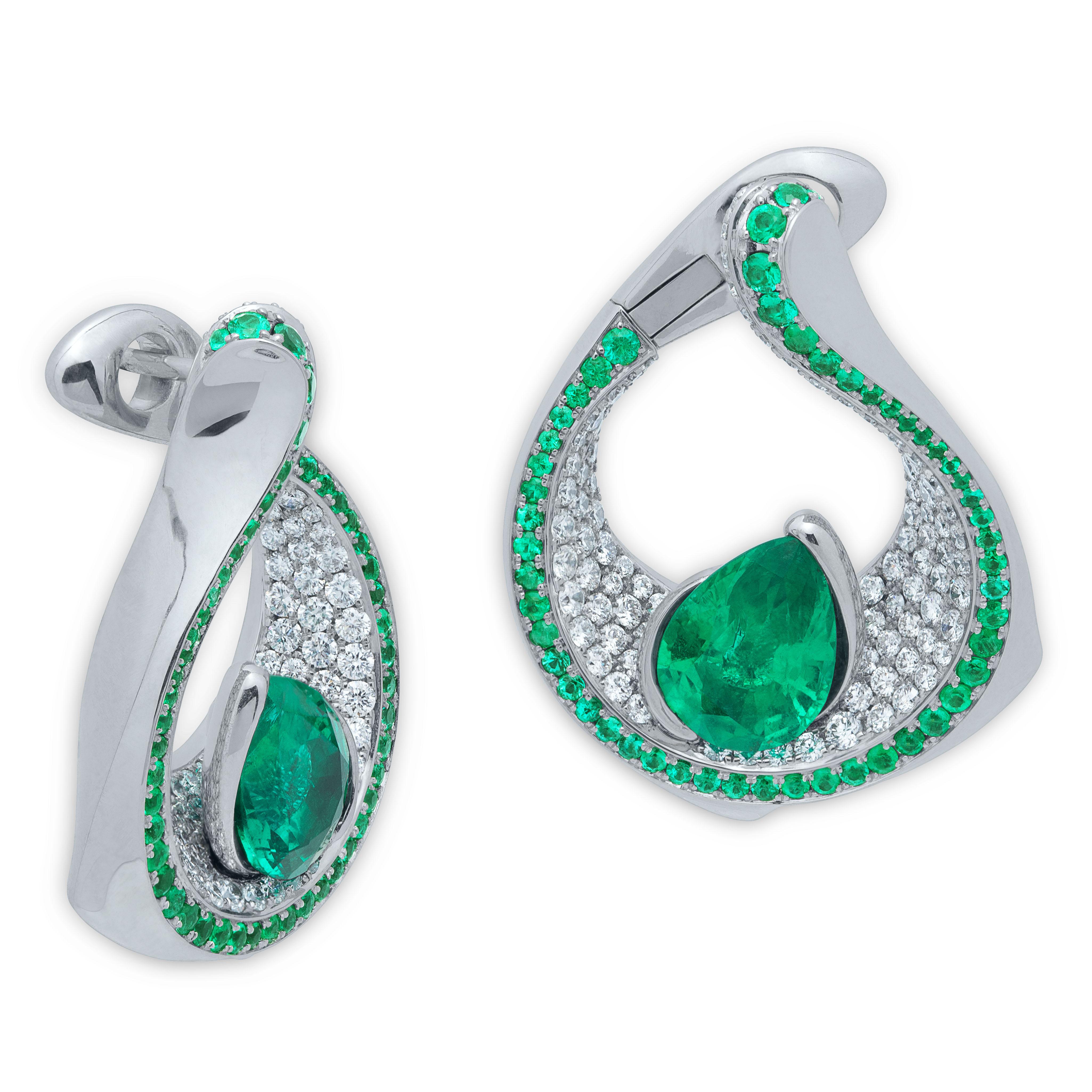 Emerald Pear Shape 4.22 Carat Diamonds Emeralds 18 Karat White Gold Earrings
Contrasting colors are always eye-catching. Our new Earrings are one of those. Two bright Pear-shaped 4.22 Carat Emeralds rests on a snow-white plateau of 240 Diamonds