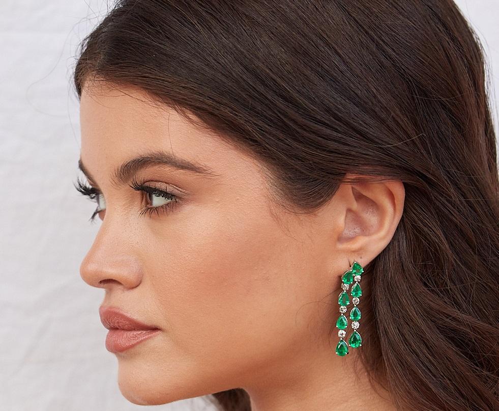 Tresor Diamond Earring features 0.79 cts diamond and 10.36 cts emerald in 18k white gold. The Earring are an ode to the luxurious yet classic beauty with sparkly diamonds. Their contemporary and modern design makes them versatile in their use. The