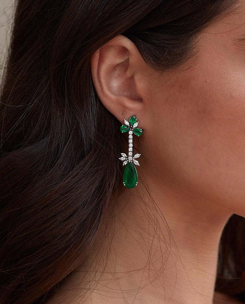 Tresor Diamond Earring features 1.41 cts diamond and 9.77 cts emerald in 18k white gold. The Earring are an ode to the luxurious yet classic beauty with sparkly diamonds. Their contemporary and modern design makes them versatile in their use. The