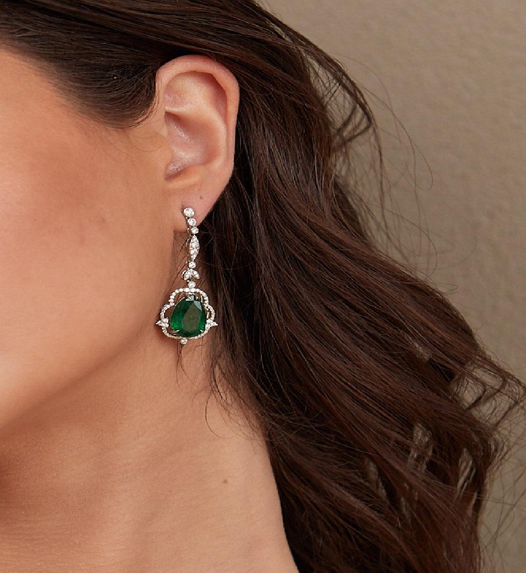 Tresor Diamond Earring features 1.10 cts diamond and 9.92 cts emerald in 18k white gold. The Earring are an ode to the luxurious yet classic beauty with sparkly diamonds. Their contemporary and modern design makes them versatile in their use. The