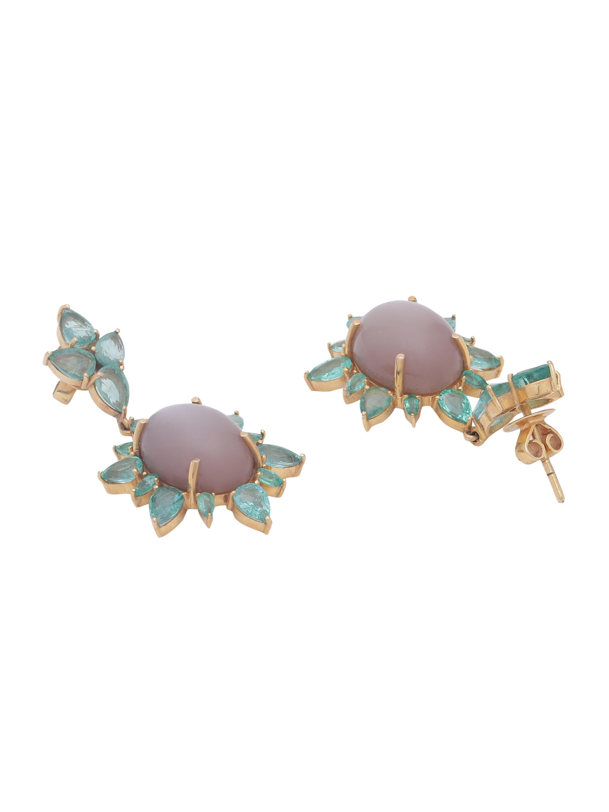 A unique pair of earrings with Brown chocolate Moonstone cabochon pair set with light colour Emerald pears all around. The combination of the Opaque Moonstone and the transparent Emeralds give the whole earring a vibrant look.
The earring is