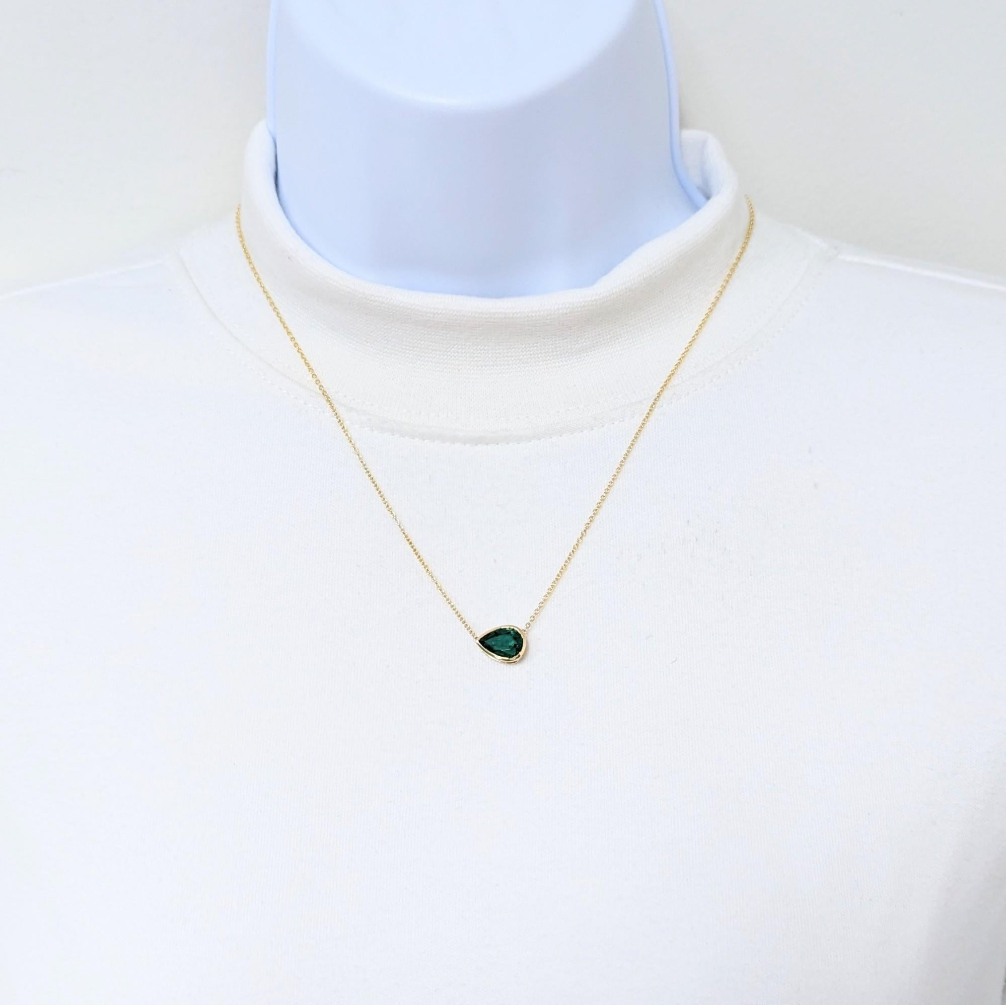 Beautiful 2.24 ct. emerald pear shape handmade in a 18k yellow gold bezel.  Length of chain is 18