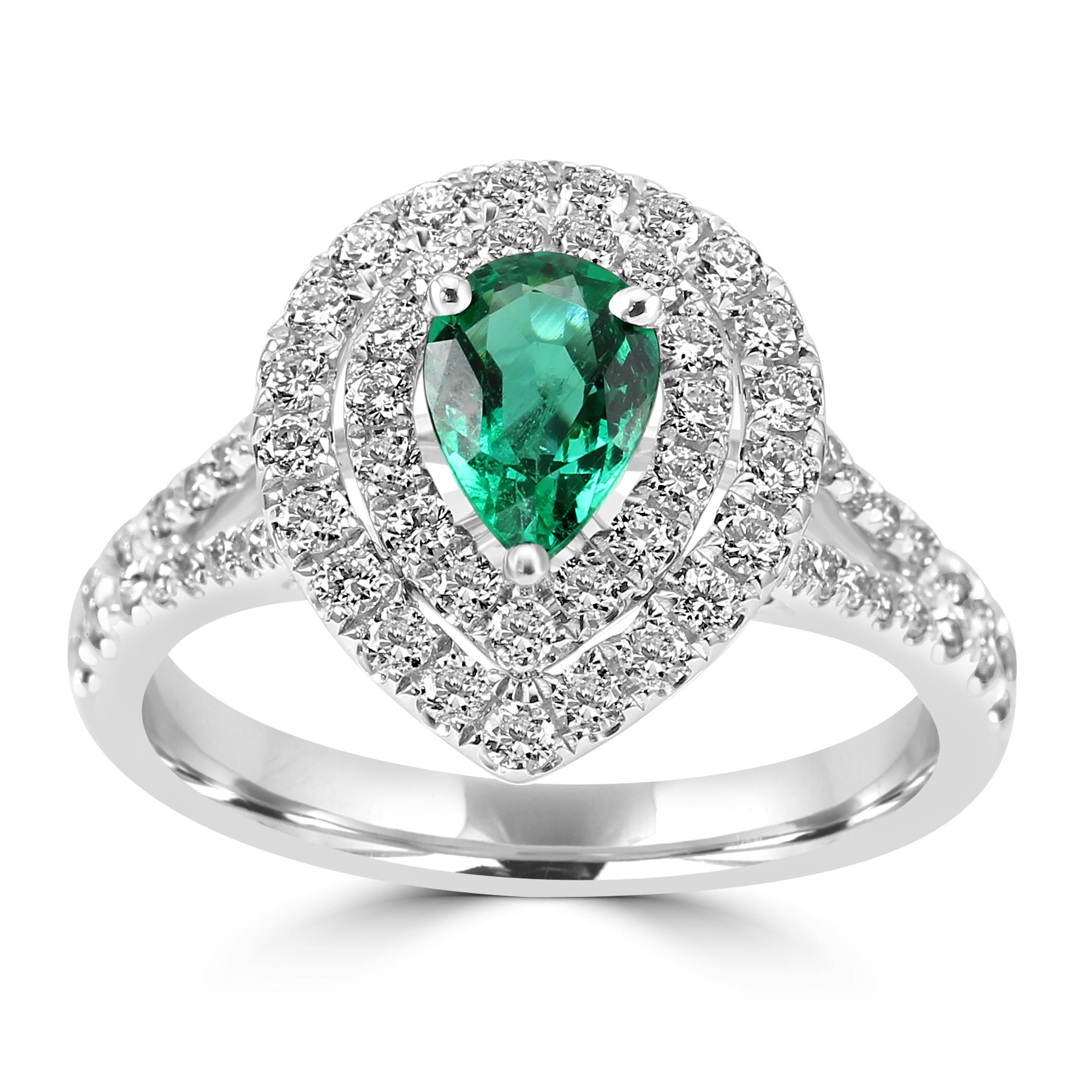 Contemplez l'incarnation de l'élégance intemporelle avec notre bague de fiançailles en émeraude en forme de poire.

Cette bague est ornée au centre d'une émeraude en forme de poire époustouflante, pesant 0,7 carat. Cette pierre précieuse envoûtante