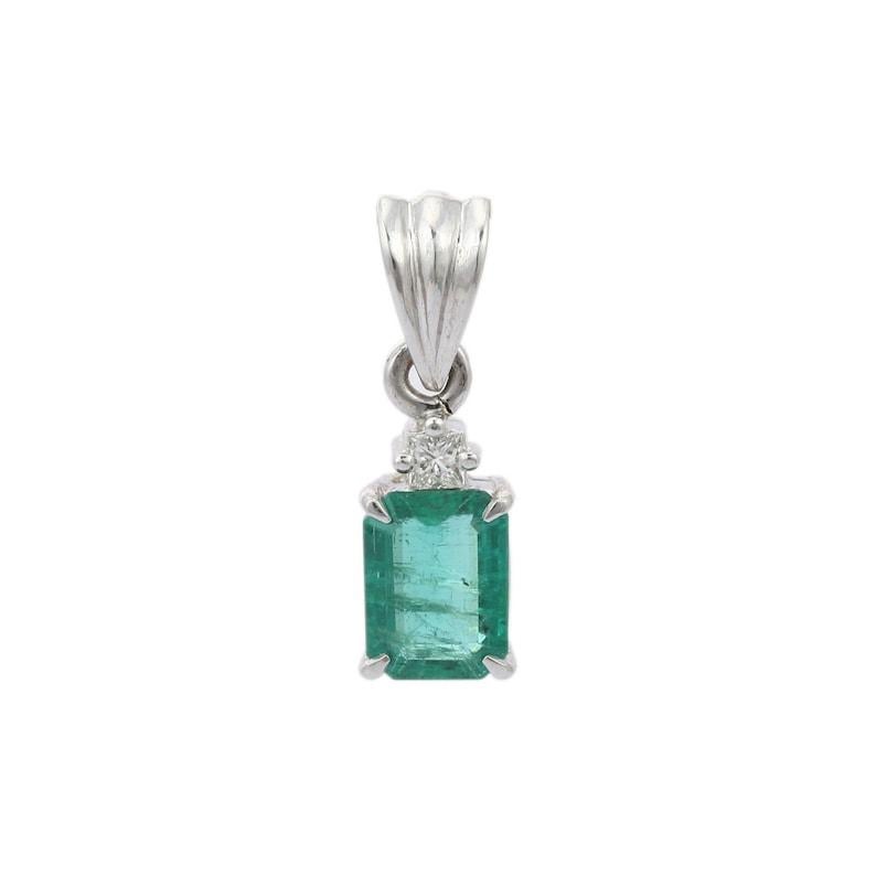 Emerald Diamond Pendant in 18K Gold studded with octagon cut emerald and square cut diamonds. This stunning piece of jewelry instantly elevates a casual look or dressy outfit. 
Emerald enhances the intellectual capacity. 
Designed with octagon cut